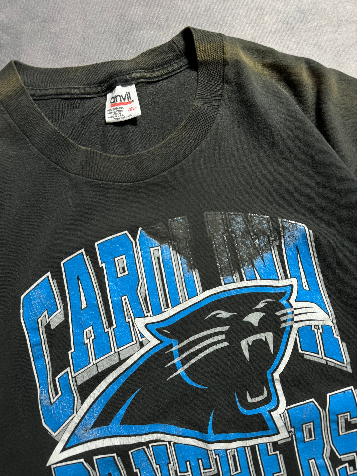 1993 Carolina Panthers Vintage Distressed Sun Faded Black Arch Block Letter Spellout NFL Tee (Large)