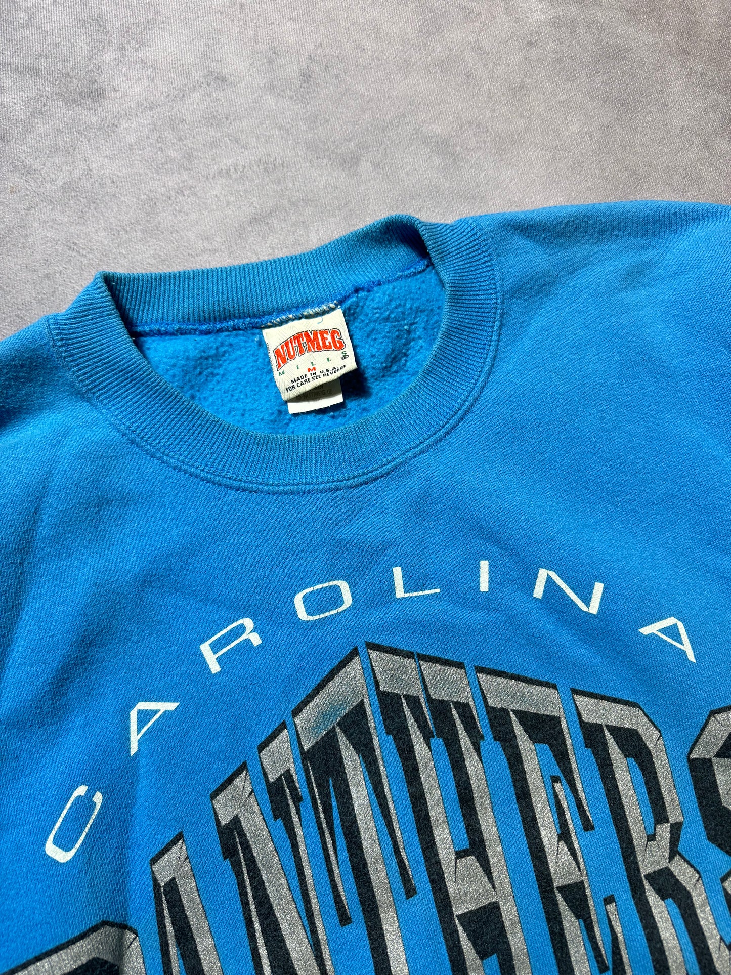 1994 Carolina Panthers Vintage Nutmeg Mills Blue Big Chevron NFL Spellout Crewneck (Medium)