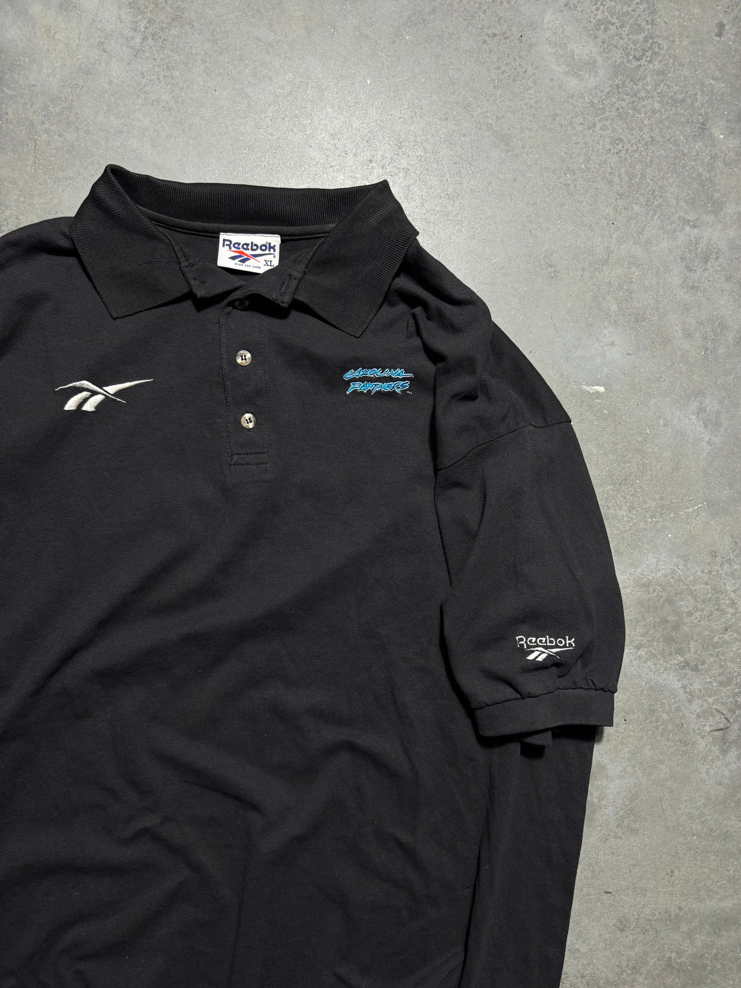 1995 Carolina Panthers Vintage Black Reebok Cat Scratch Font Logo Embroidered Sideline Style NFL Collared Polo Shirt (XL)