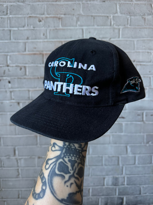90’s Carolina Panthers Vintage Black Logo 7 Interlocking Spellout NFL Snapback Hat (OSFA)