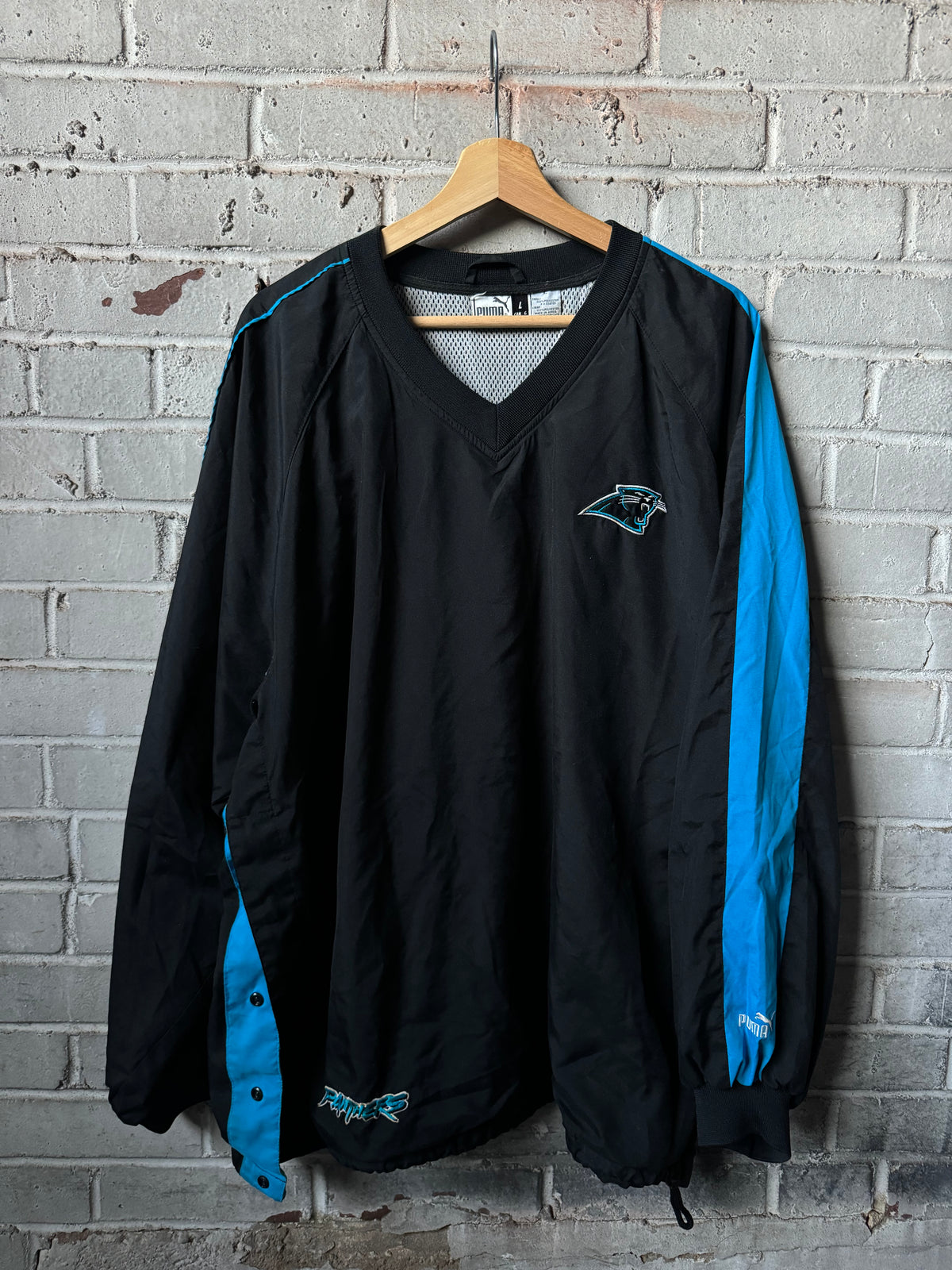 90’s Carolina Panthers Vintage Black Blue Puma Asymmetrical Sleeve Stripe Cat Scratch Font NFL Pullover Jacket (XL)