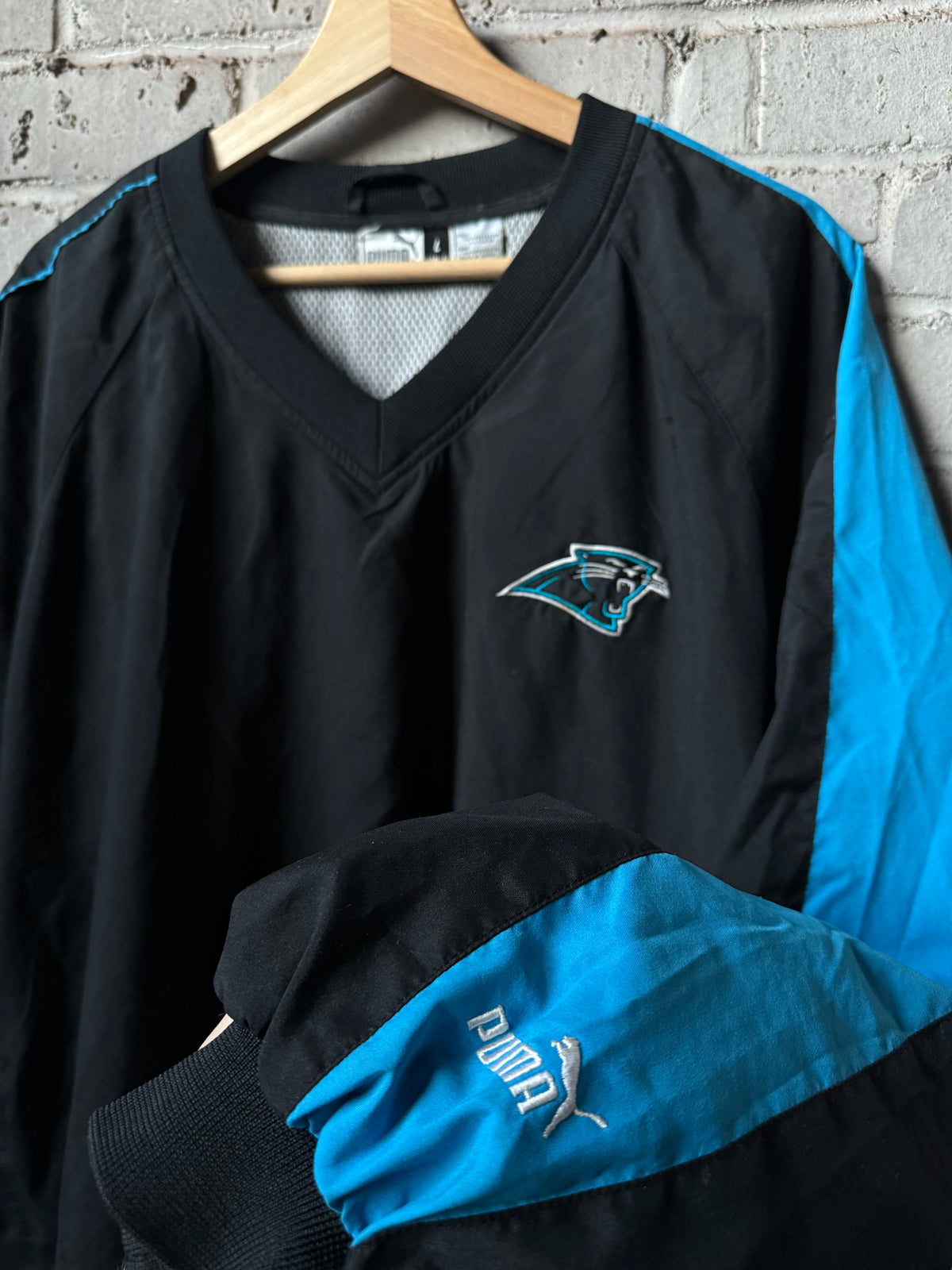 90’s Carolina Panthers Vintage Black Blue Puma Asymmetrical Sleeve Stripe Cat Scratch Font NFL Pullover Jacket (XL)