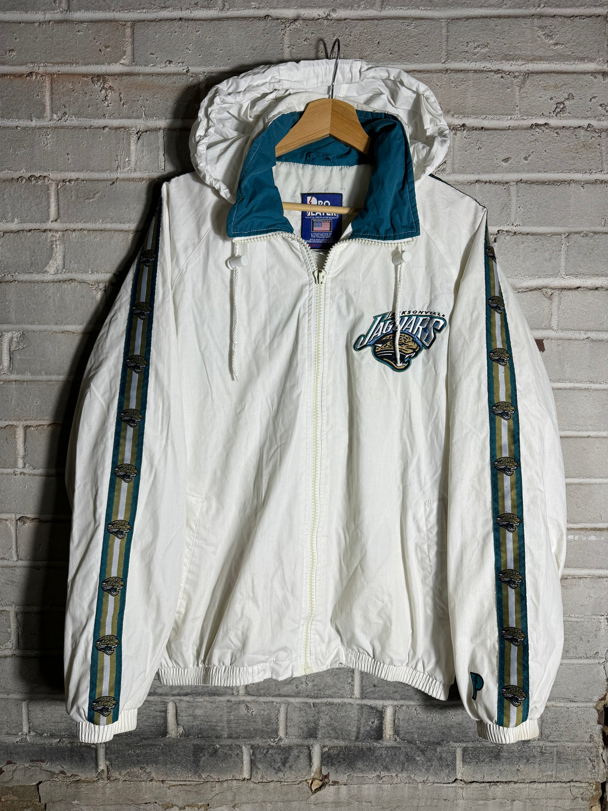 90’s Jacksonville Jaguars Vintage White Repeat Logo Pro Player Full Zip NFL Windbreaker Jacket (Medium)