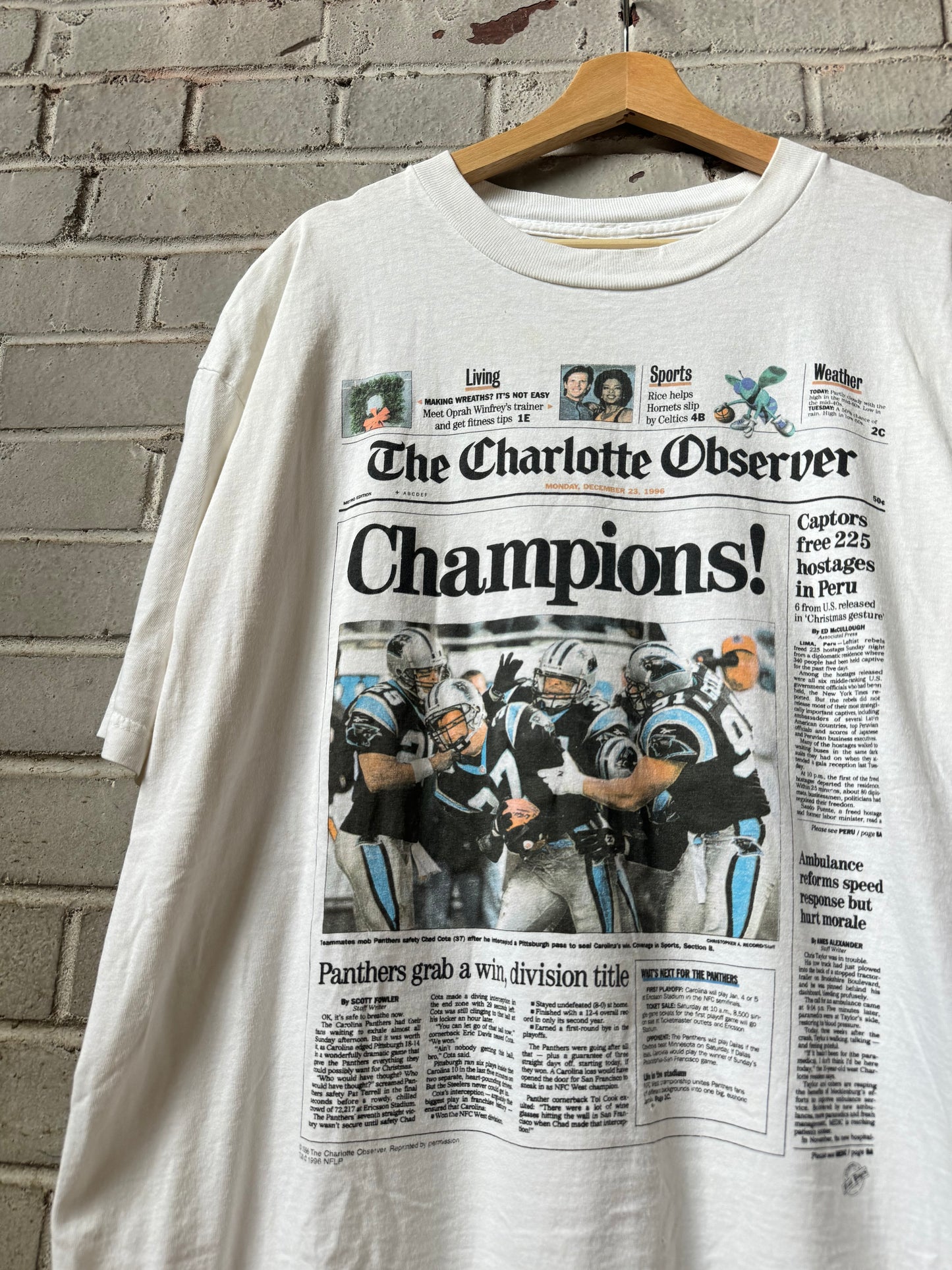 1996 Carolina Panthers Vintage White Charlotte Observer “Champions!” NFC West Division Champions Newspaper Clip NFL Tee (XL)