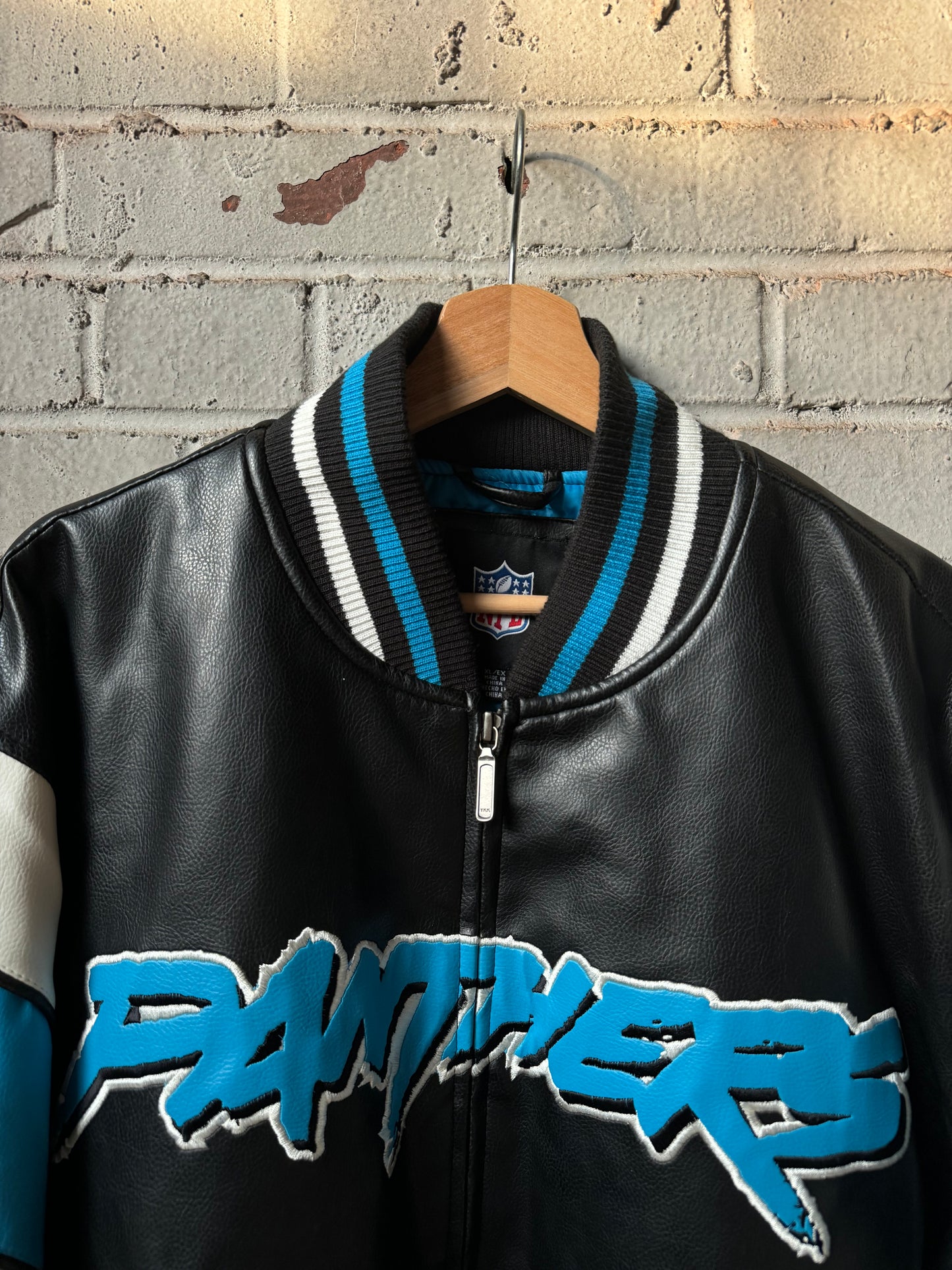 00’s Carolina Panthers Vintage Cat Scratch Font Big Logo Shoulder Striped NFL Leather Jacket (XL)
