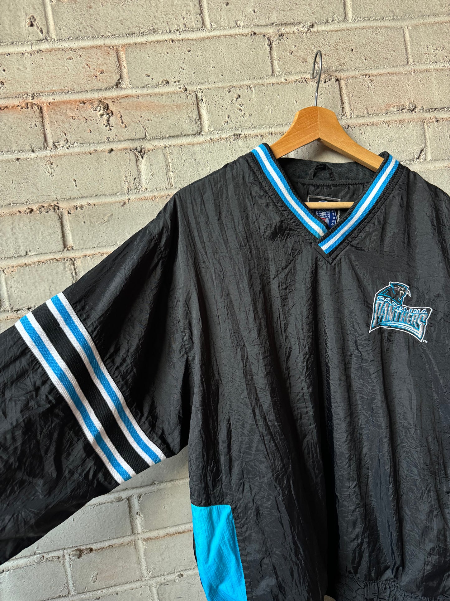 90’s Carolina Panthers Vintage Black Sleeve Striped NFL Windbreaker Pullover (Medium)