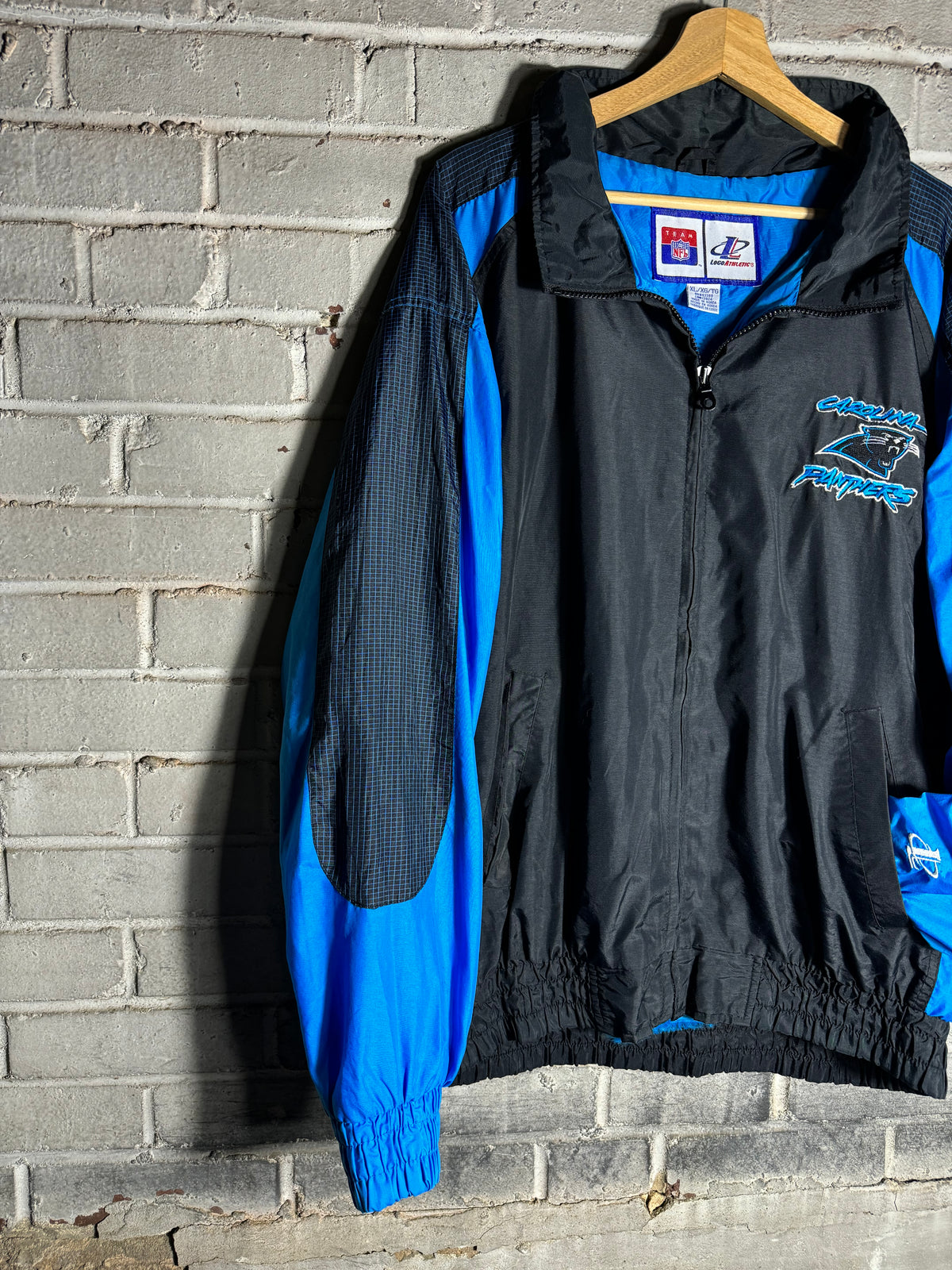 90’s Carolina Panthers Vintage Black Blue Logo Athletic Cat Scratch Font Full Zip Windbreaker Jacket (XL)