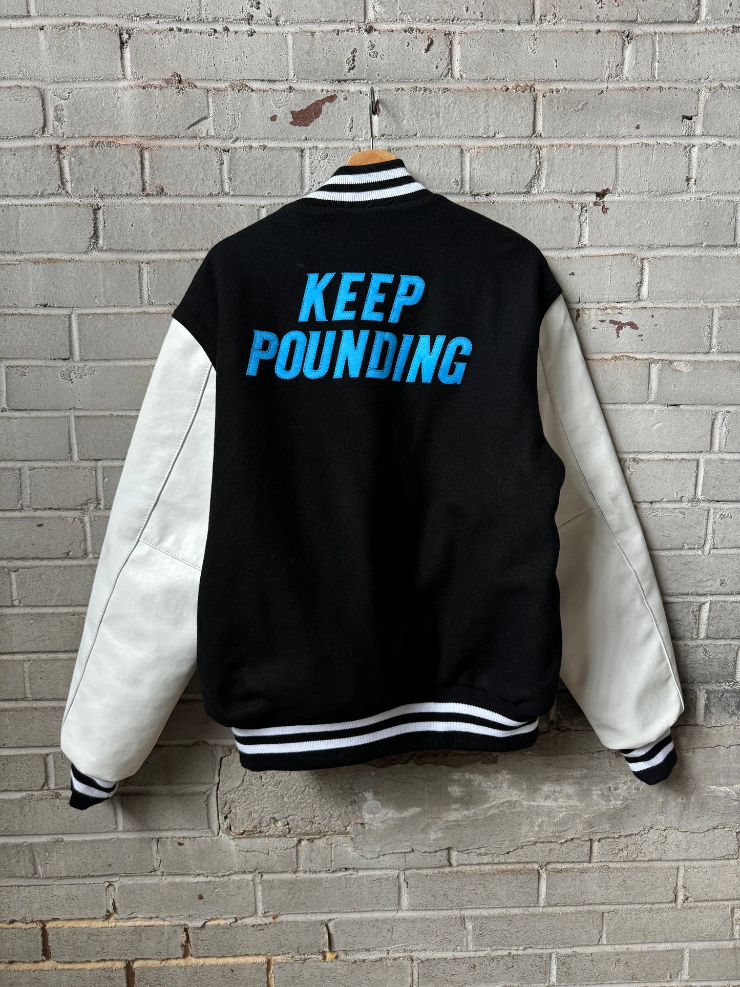 Carolina Panthers Black Keep Pounding Holloway Heavyweight Leather NFL Varsity Jacket (Large)