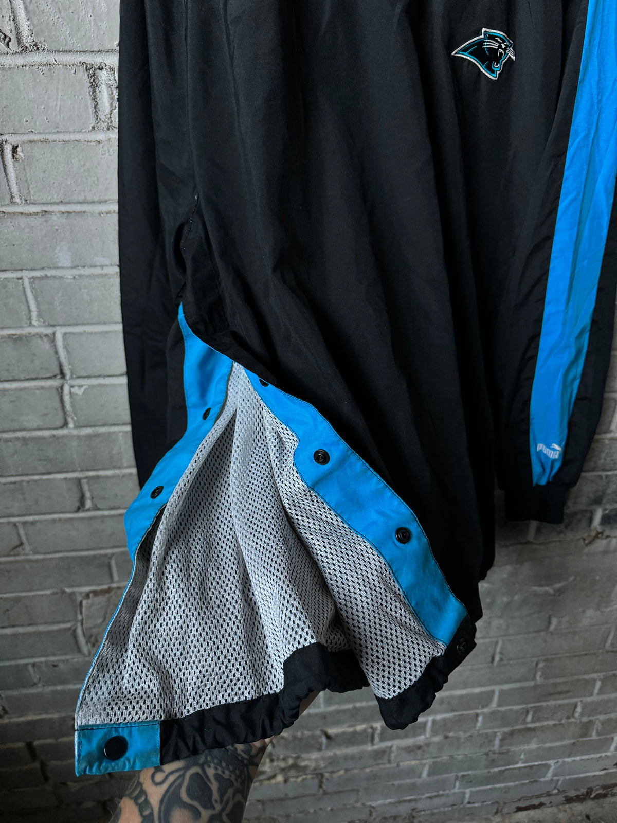 90’s Carolina Panthers Vintage Black Blue Puma Asymmetrical Sleeve Stripe Cat Scratch Font NFL Pullover Jacket (XL)