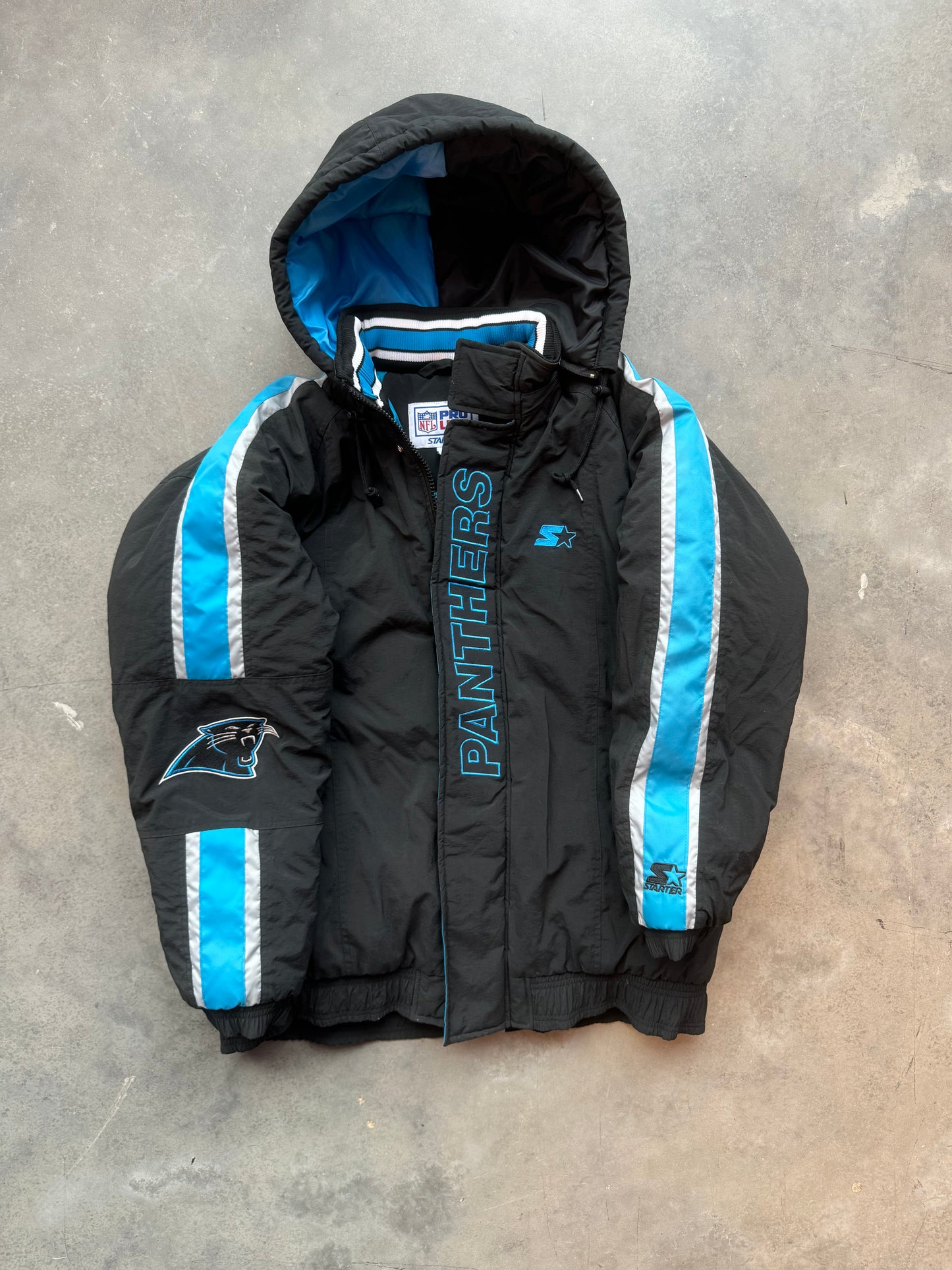 90’s Carolina Panthers Vintage Starter Spellout Striped Big Logo Black NFL Puffer Jacket (Large)