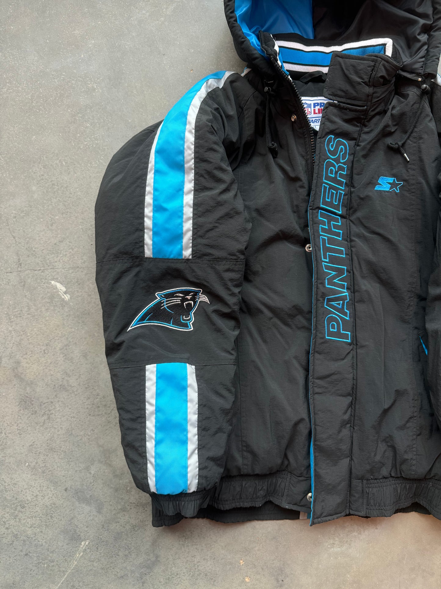 90’s Carolina Panthers Vintage Starter Spellout Striped Big Logo Black NFL Puffer Jacket (Large)