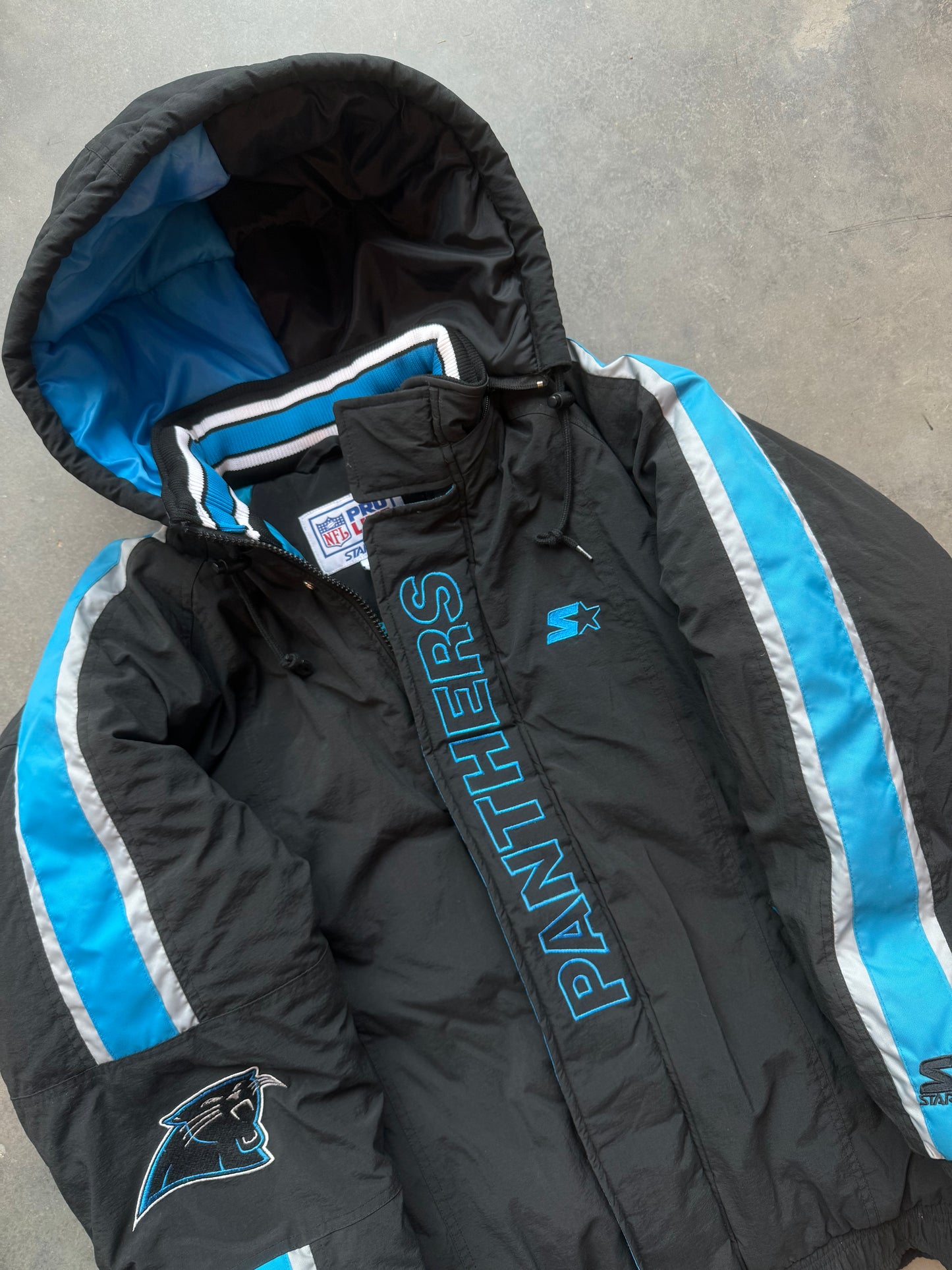 90’s Carolina Panthers Vintage Starter Spellout Striped Big Logo Black NFL Puffer Jacket (Large)