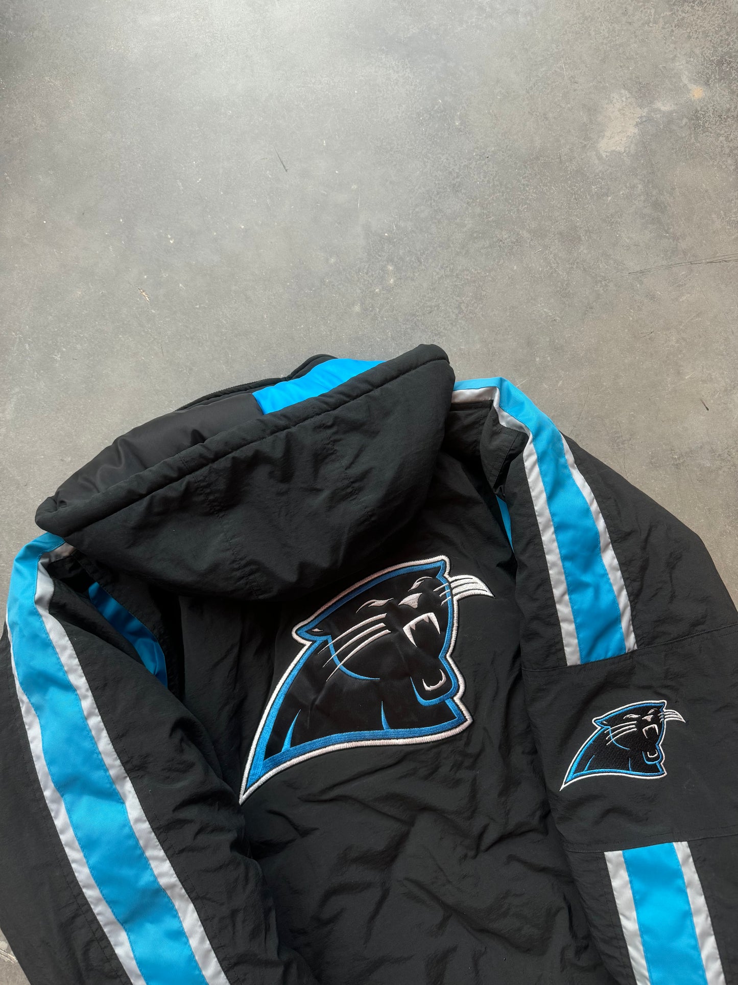 90’s Carolina Panthers Vintage Starter Spellout Striped Big Logo Black NFL Puffer Jacket (Large)