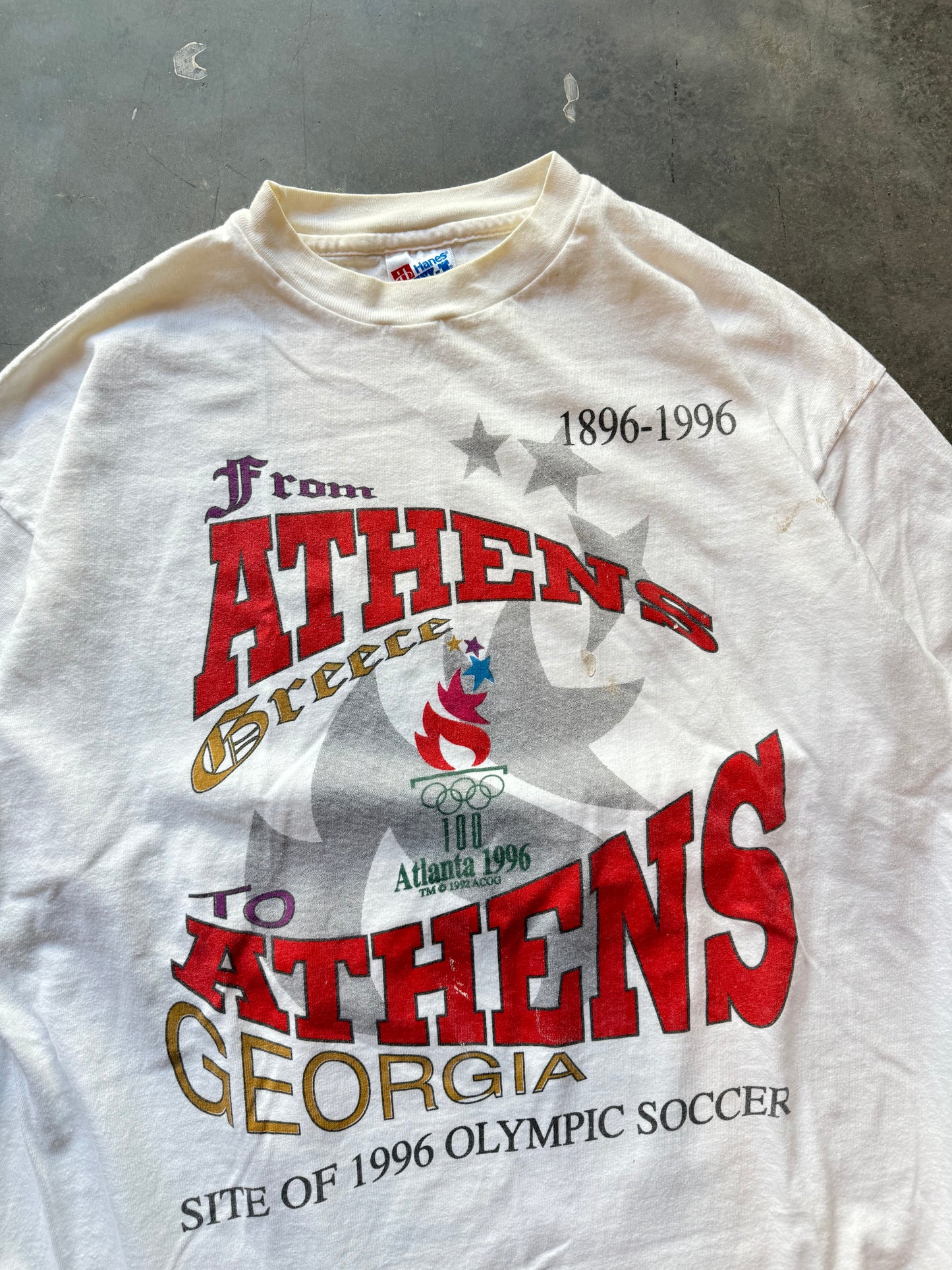 1996 Atlanta “From Athens to Athens”Vintage White Summer Olympics Paint Distressed Tee (XL)