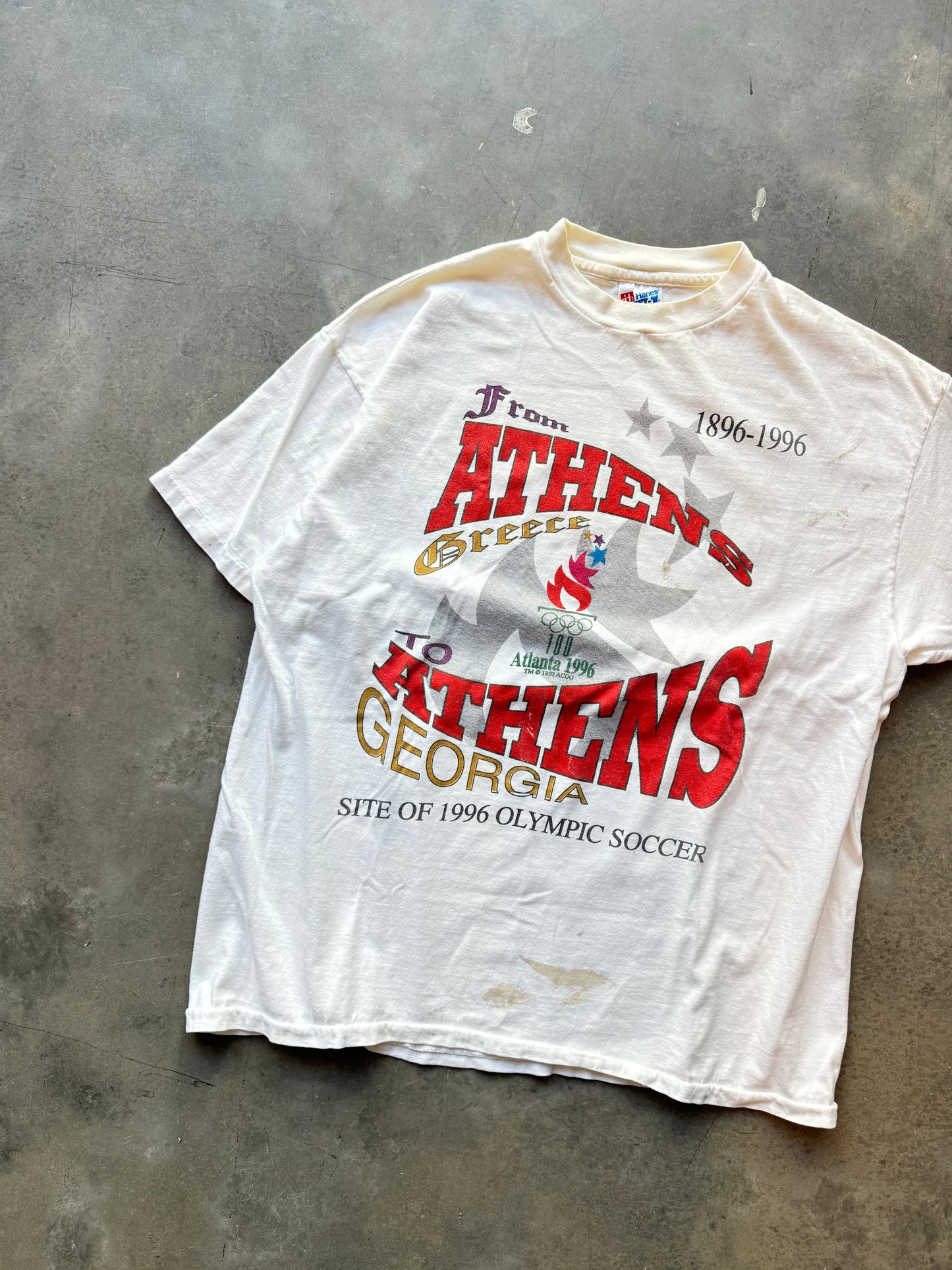 1996 Atlanta “From Athens to Athens”Vintage White Summer Olympics Paint Distressed Tee (XL)