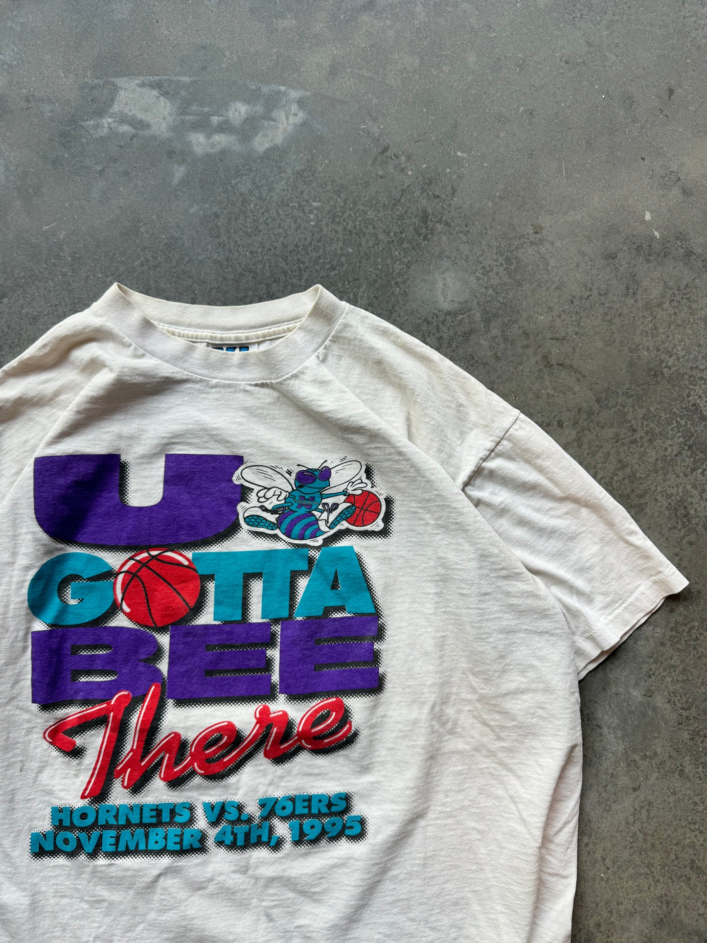 1995 Charlotte Hornets “U Gotta Bee There” vs. Philadelphia 76ers Home Opener Vintage NBA Tee (XL)