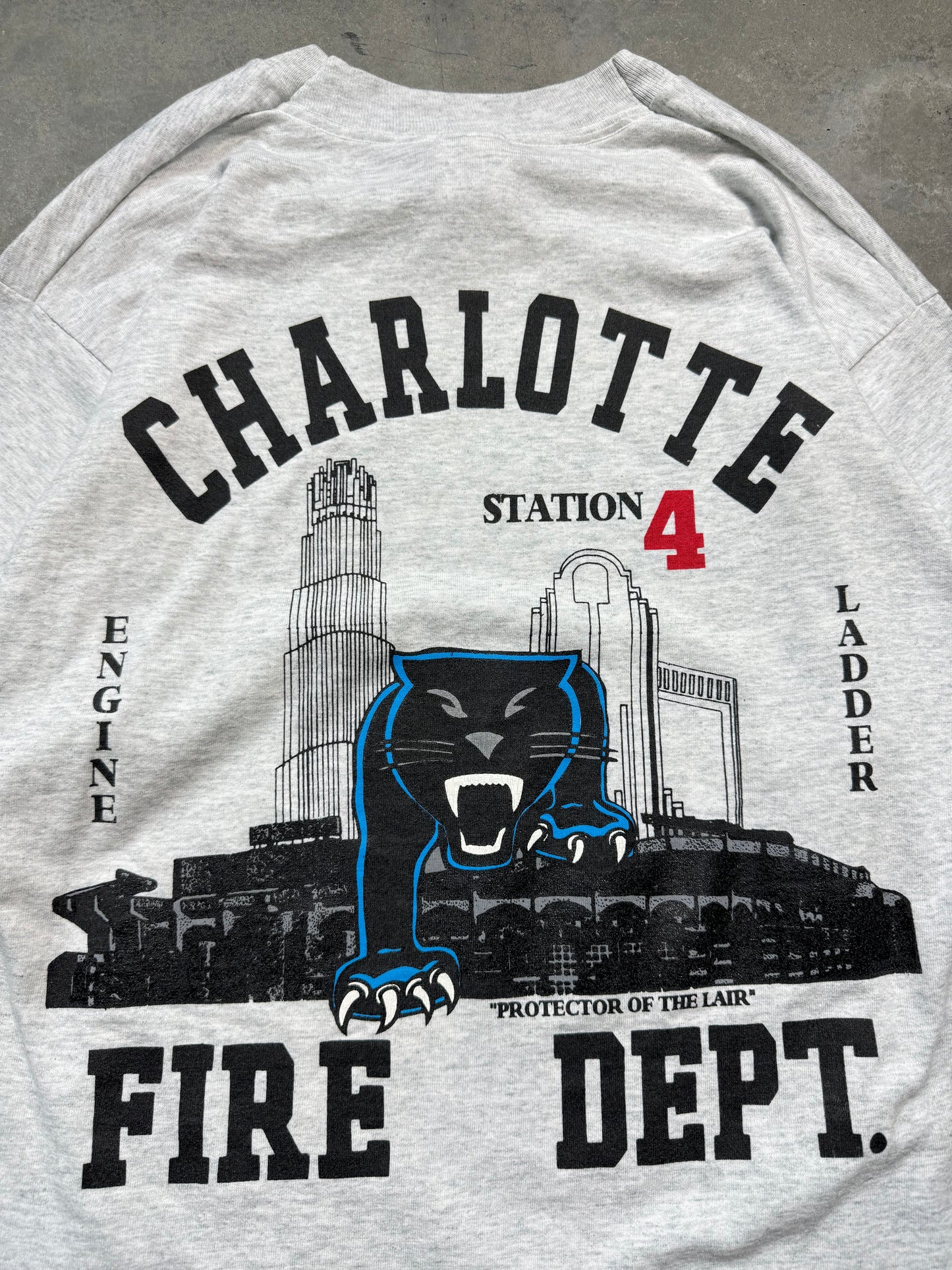 00’s Carolina Panthers x Charlotte Fire Dept Station 4 “Protectors of the Lair” Vintage Heather Grey NFL Tee (Medium)