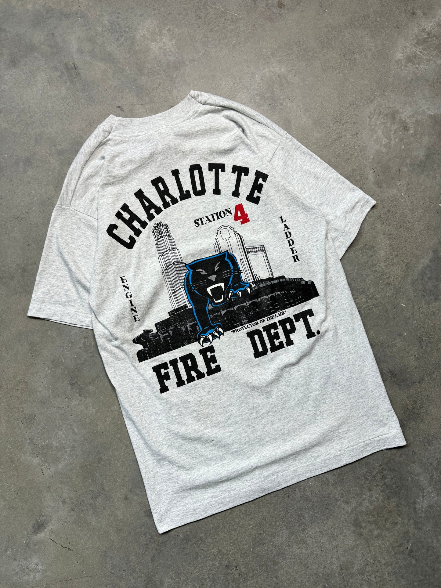 00’s Carolina Panthers x Charlotte Fire Dept Station 4 “Protectors of the Lair” Vintage Heather Grey NFL Tee (Medium)