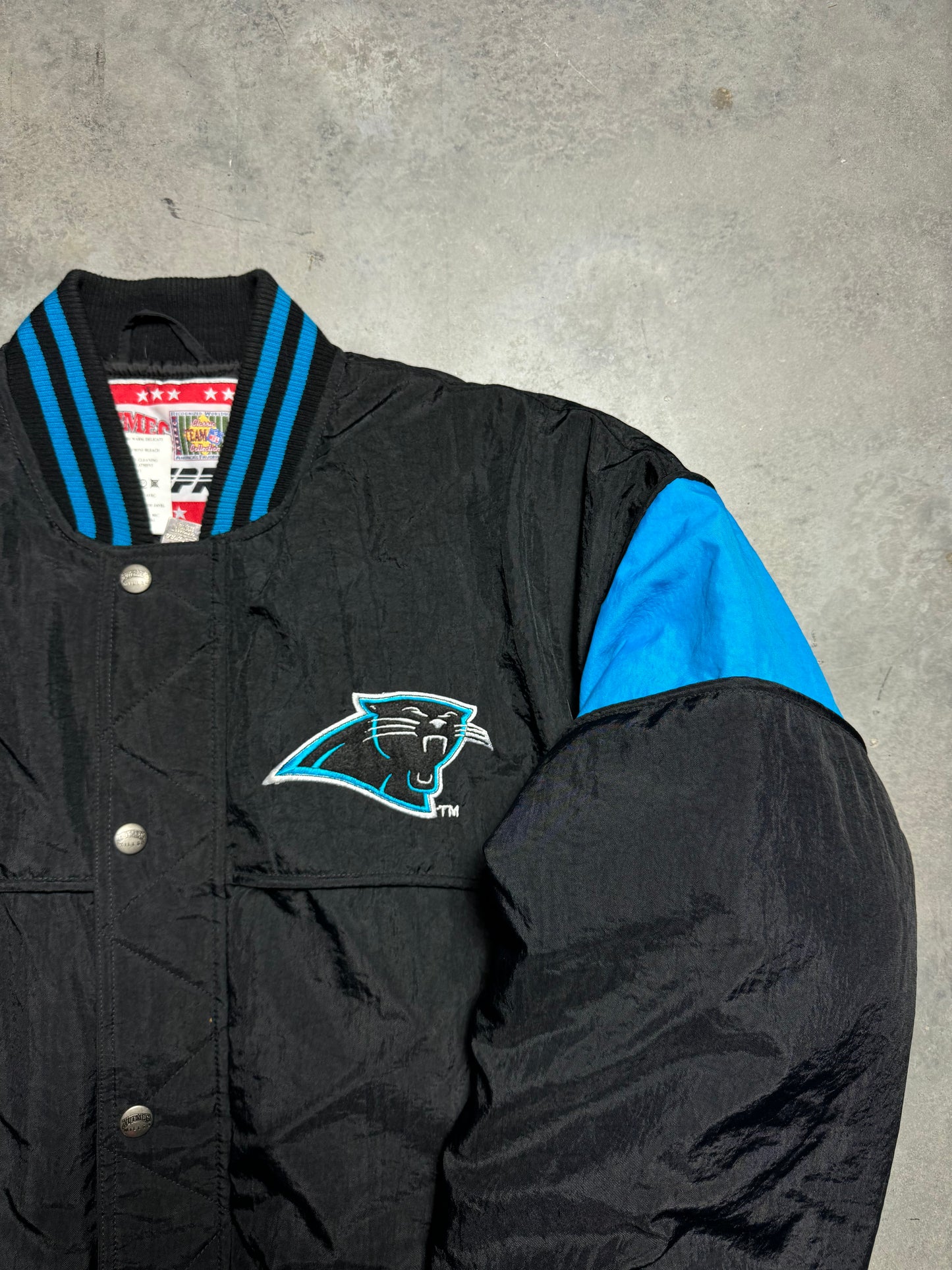 90’s Carolina Panthers Vintage Black Nutmeg Mills Campri Full Cat Alternate Logo NFL Quilted Bomber Nylon Jacket (XL)
