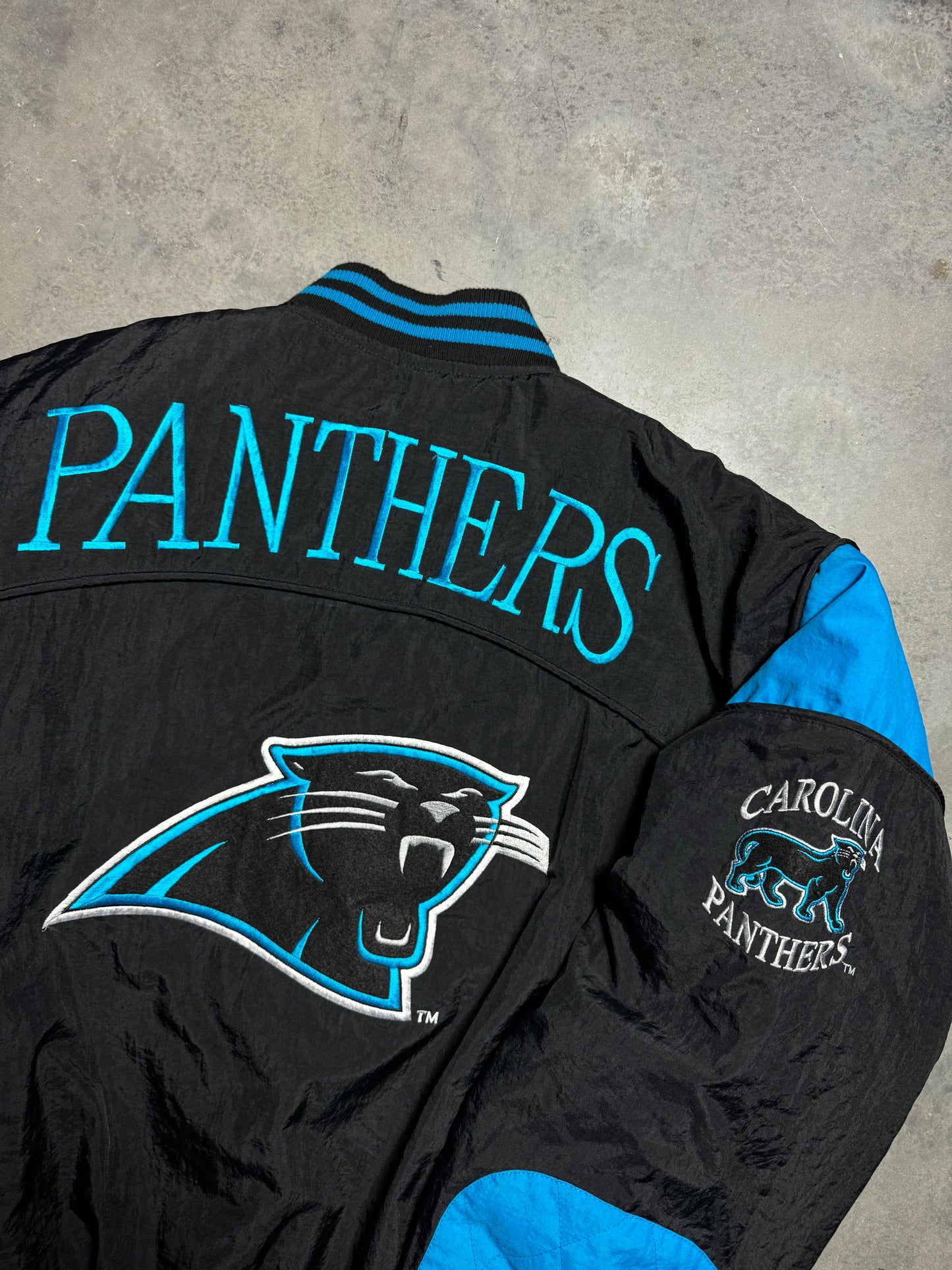 90’s Carolina Panthers Vintage Black Nutmeg Mills Campri Full Cat Alternate Logo NFL Quilted Bomber Nylon Jacket (XL)