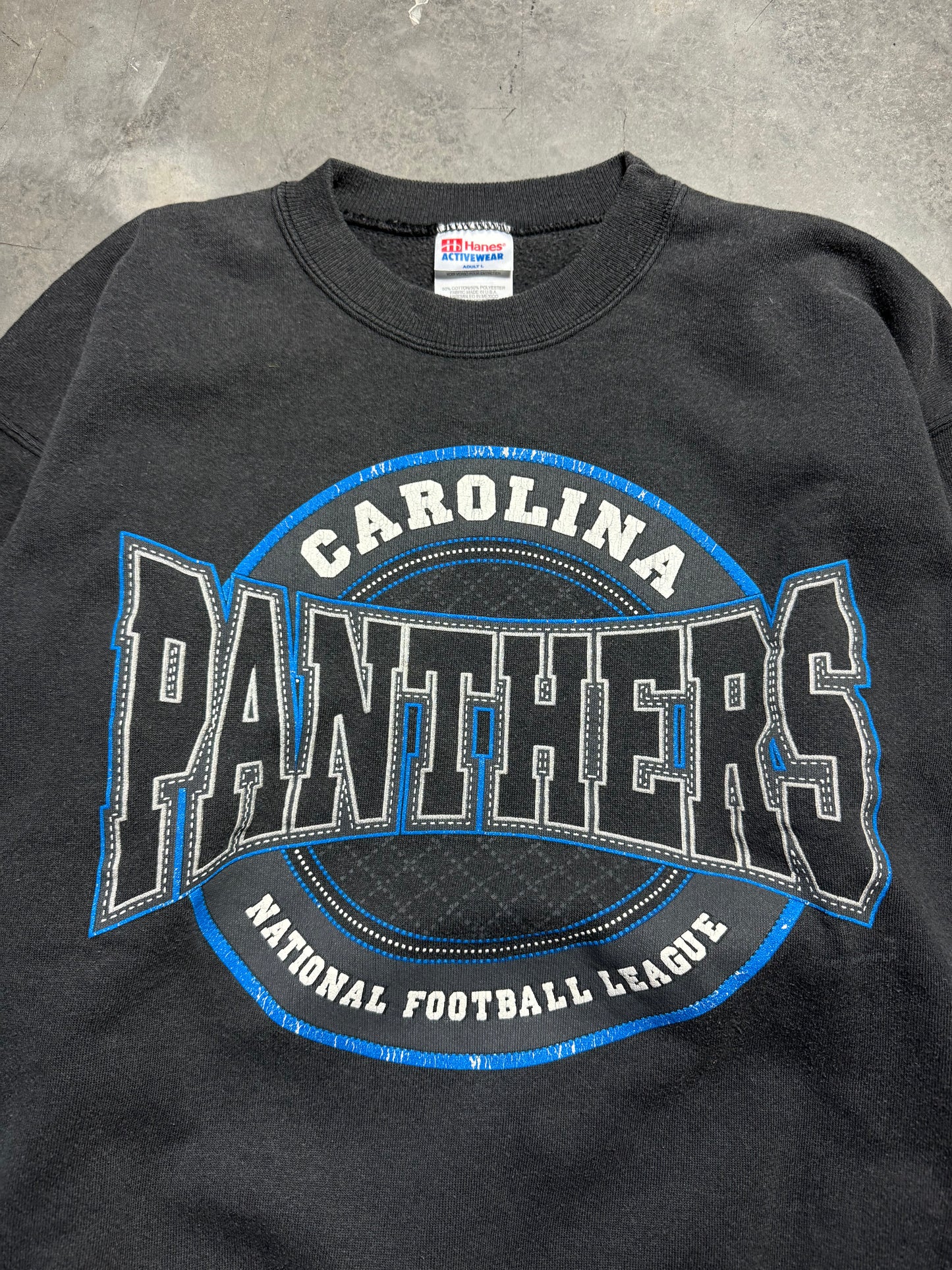 1996 Carolina Panthers Vintage Faded Black Sphere Spellout Logo NFL Crewneck (Large)