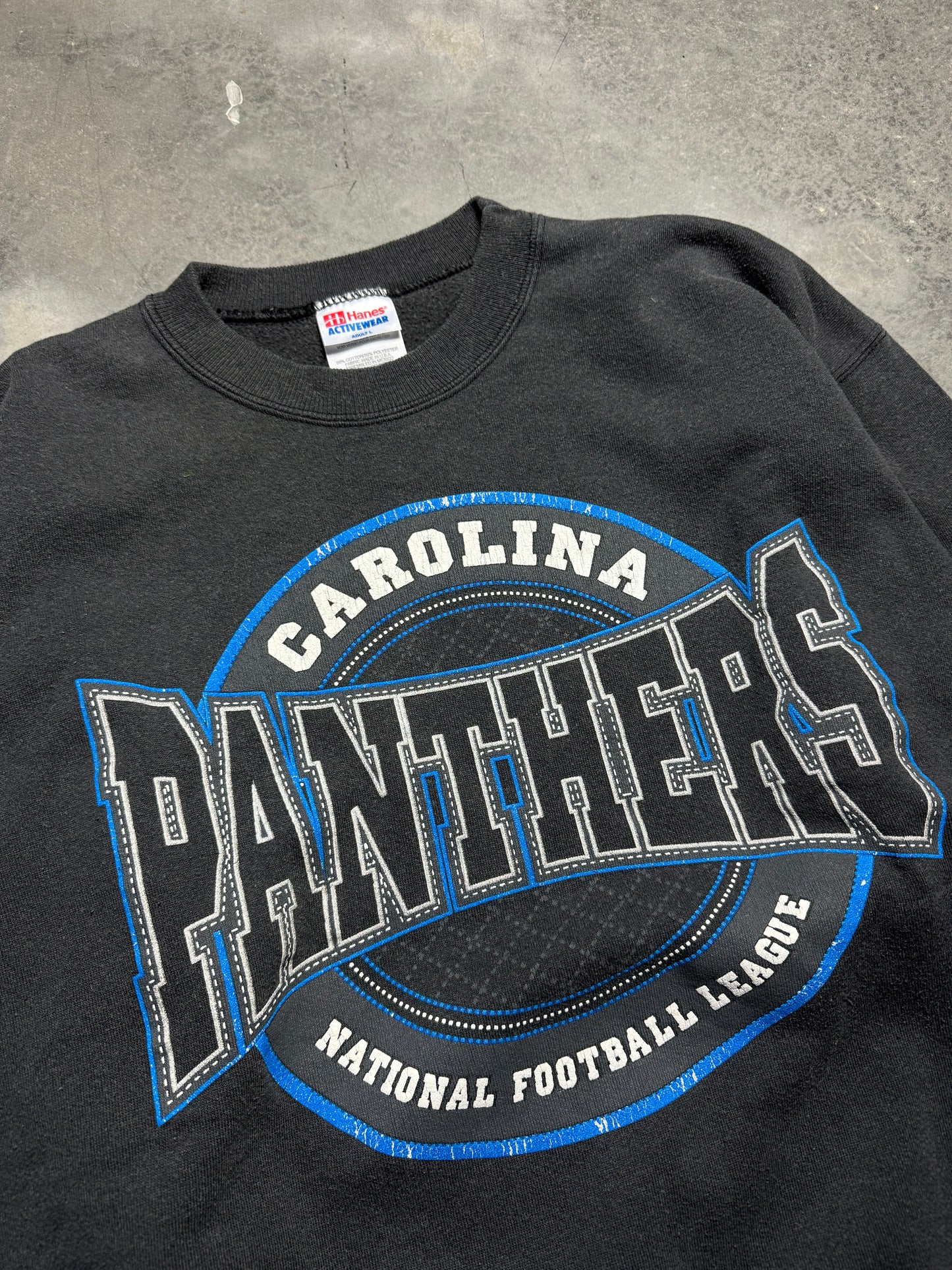 1996 Carolina Panthers Vintage Faded Black Sphere Spellout Logo NFL Crewneck (Large)
