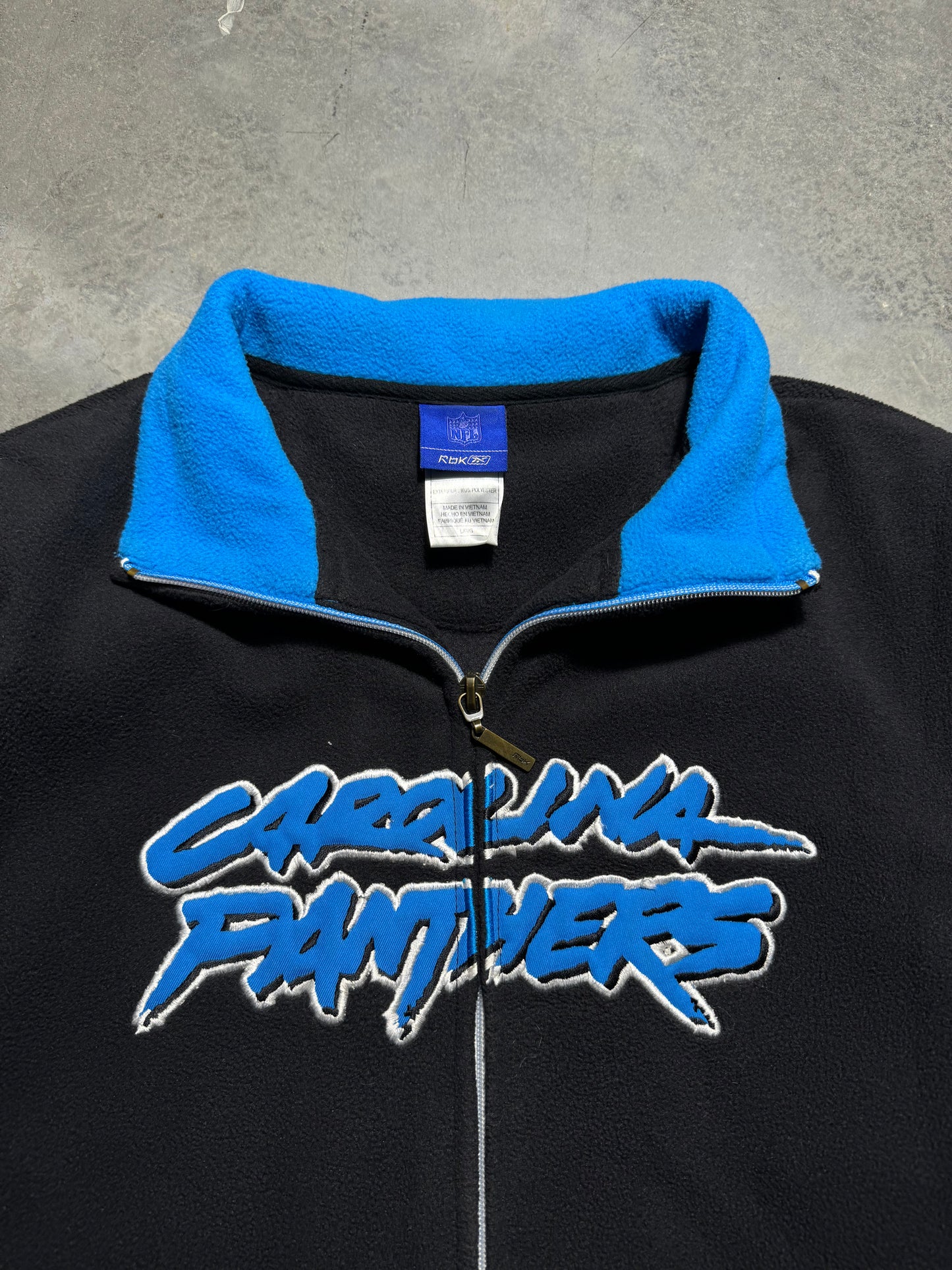 00’s Carolina Panthers Vintage Black Reebok Fleece Cat Scratch Font Embroidered Spellout Zip Up NFL Jacket (Women’s Large)