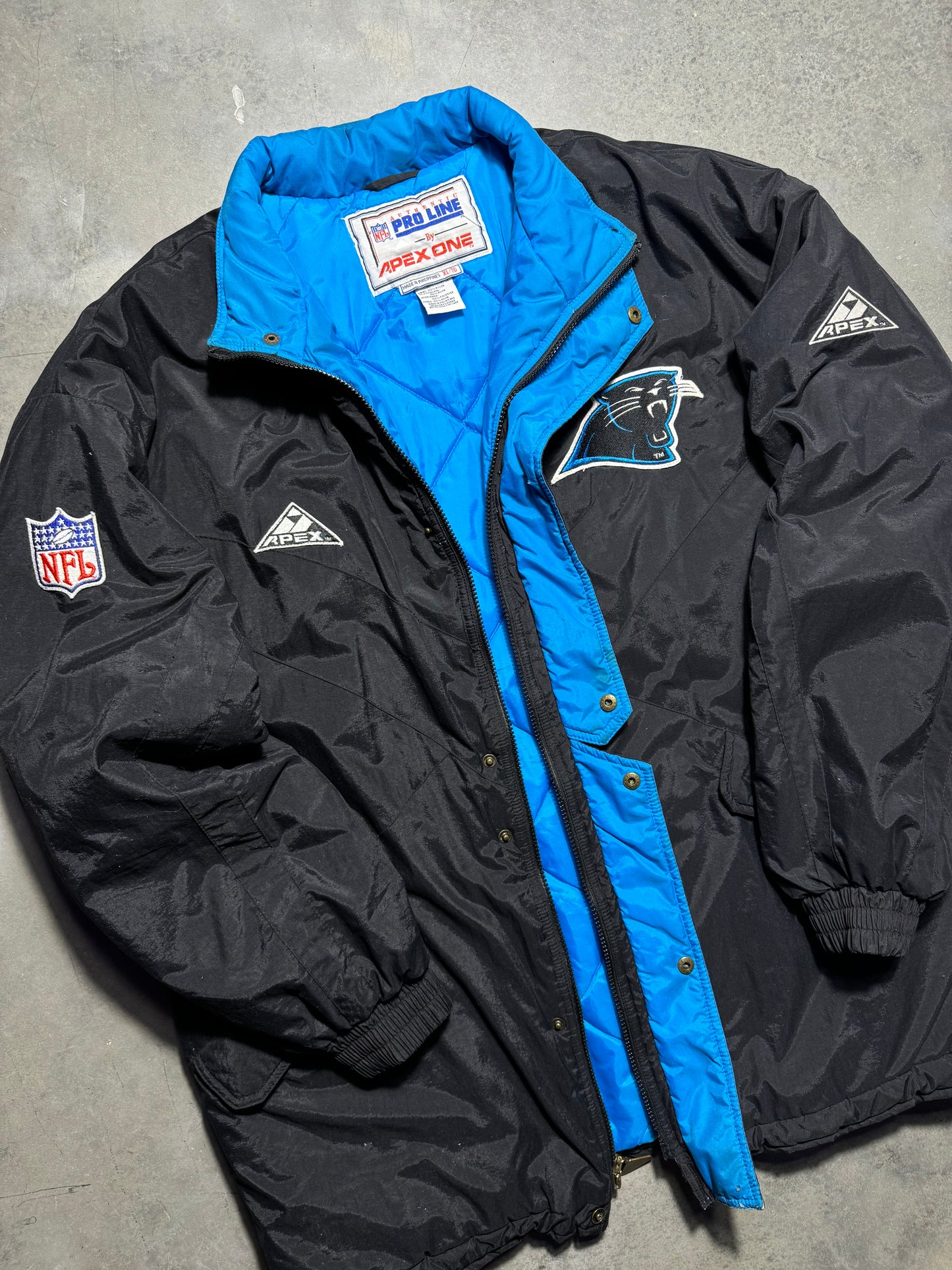 90’s Carolina Panthers Vintage Black Apex One Big Logo NFL Sideline Trench Puffer Jacket (XL)