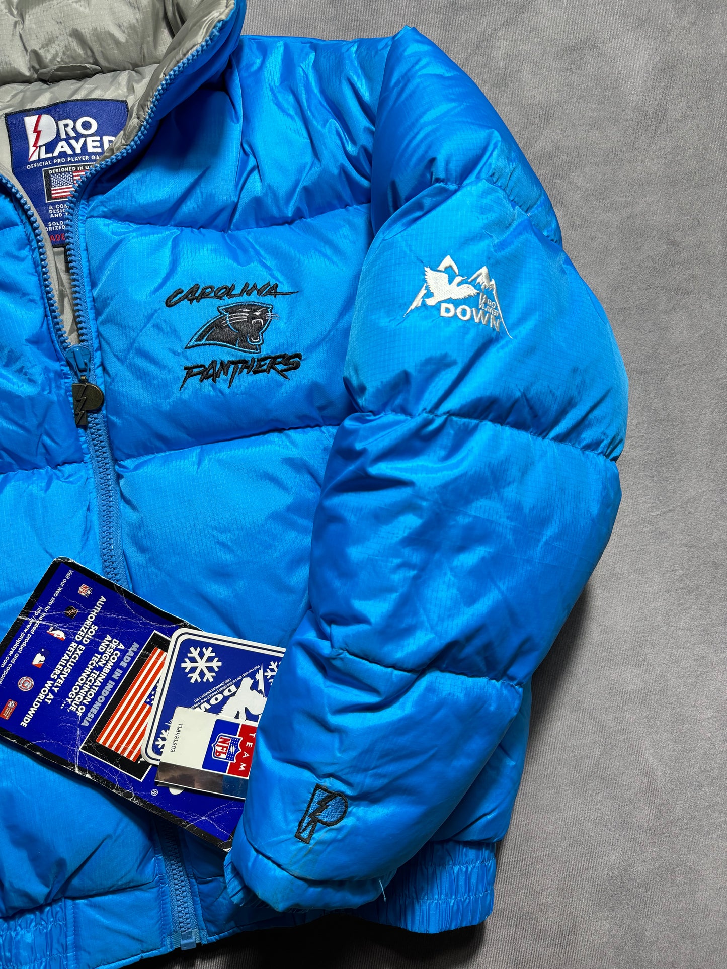 90’s Carolina Panthers Vintage Blue Cat Scratch Font Pro Player Down Bubble NFL Jacket - Deadstock (Medium)