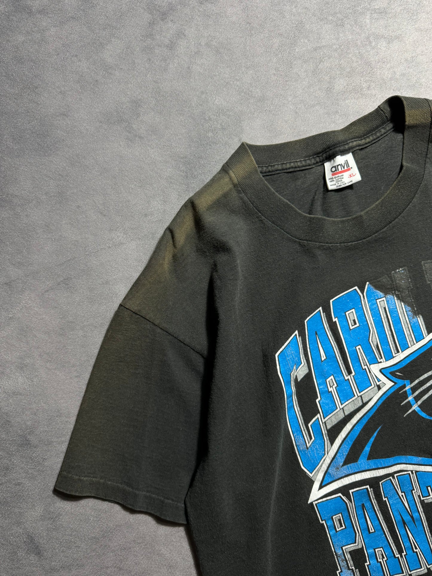 1993 Carolina Panthers Vintage Distressed Sun Faded Black Arch Block Letter Spellout NFL Tee (Large)