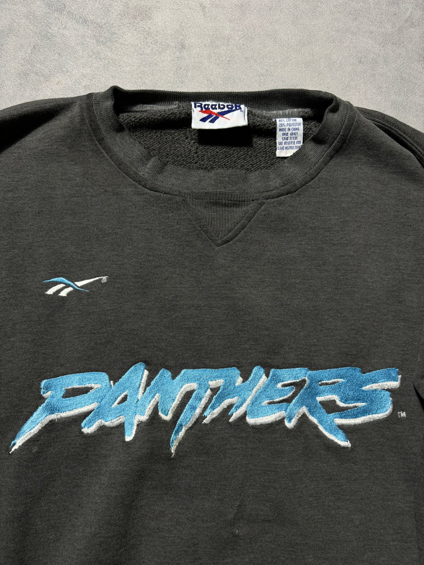 1995 Carolina Panthers Vintage Faded Black Reebok Embroidered Cat Scratch Font NFL Crewneck (Large)
