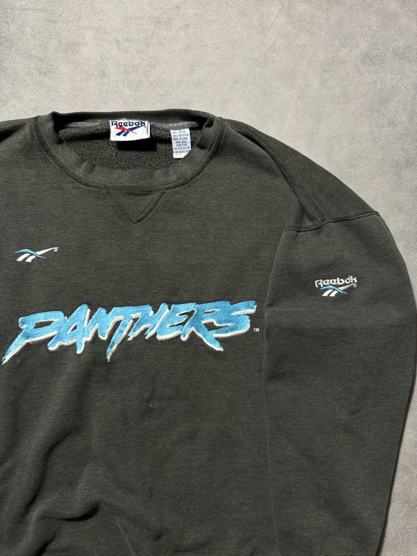 1995 Carolina Panthers Vintage Faded Black Reebok Embroidered Cat Scratch Font NFL Crewneck (Large)