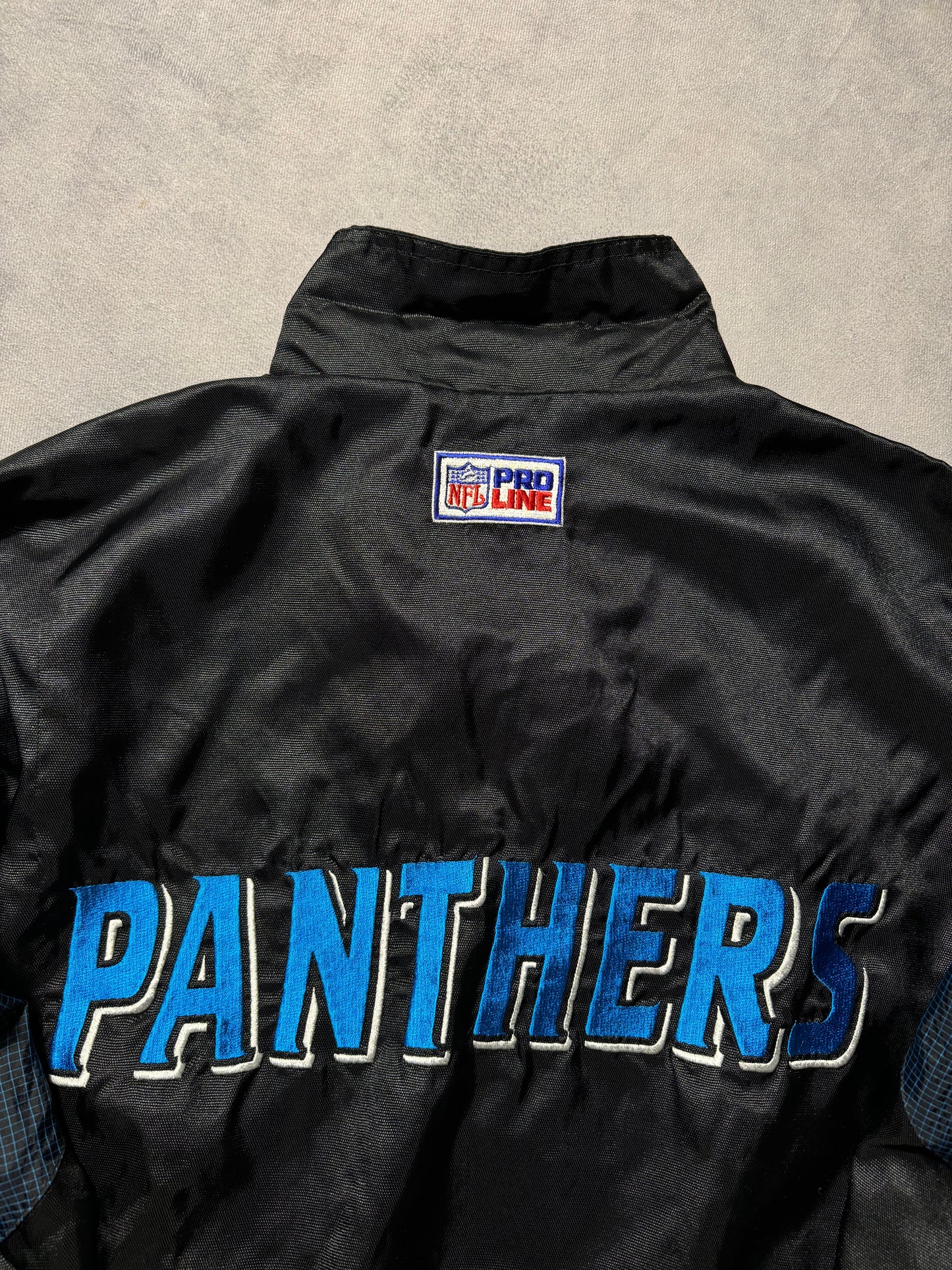 90’s Carolina Panthers Vintage Black Logo Athletic Multi Logo Embroidered NFL Windbreaker Jacket (Medium)