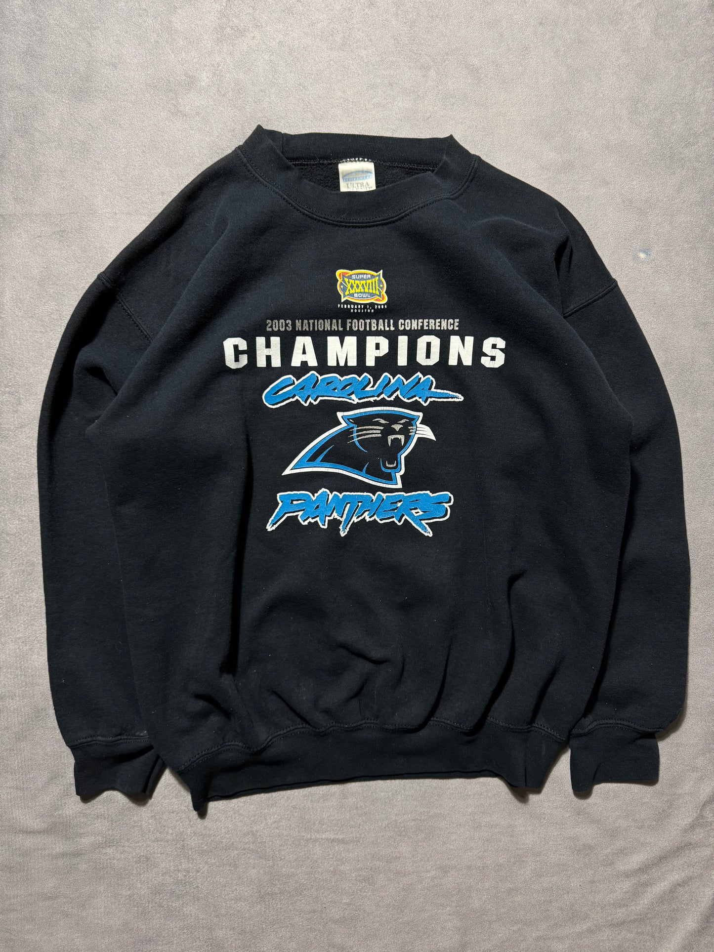 2003 Carolina Panthers Vintage NFC Champions Super Bowl XXXVIII Cat Scratch Font Logo NFL Crewneck (Medium)