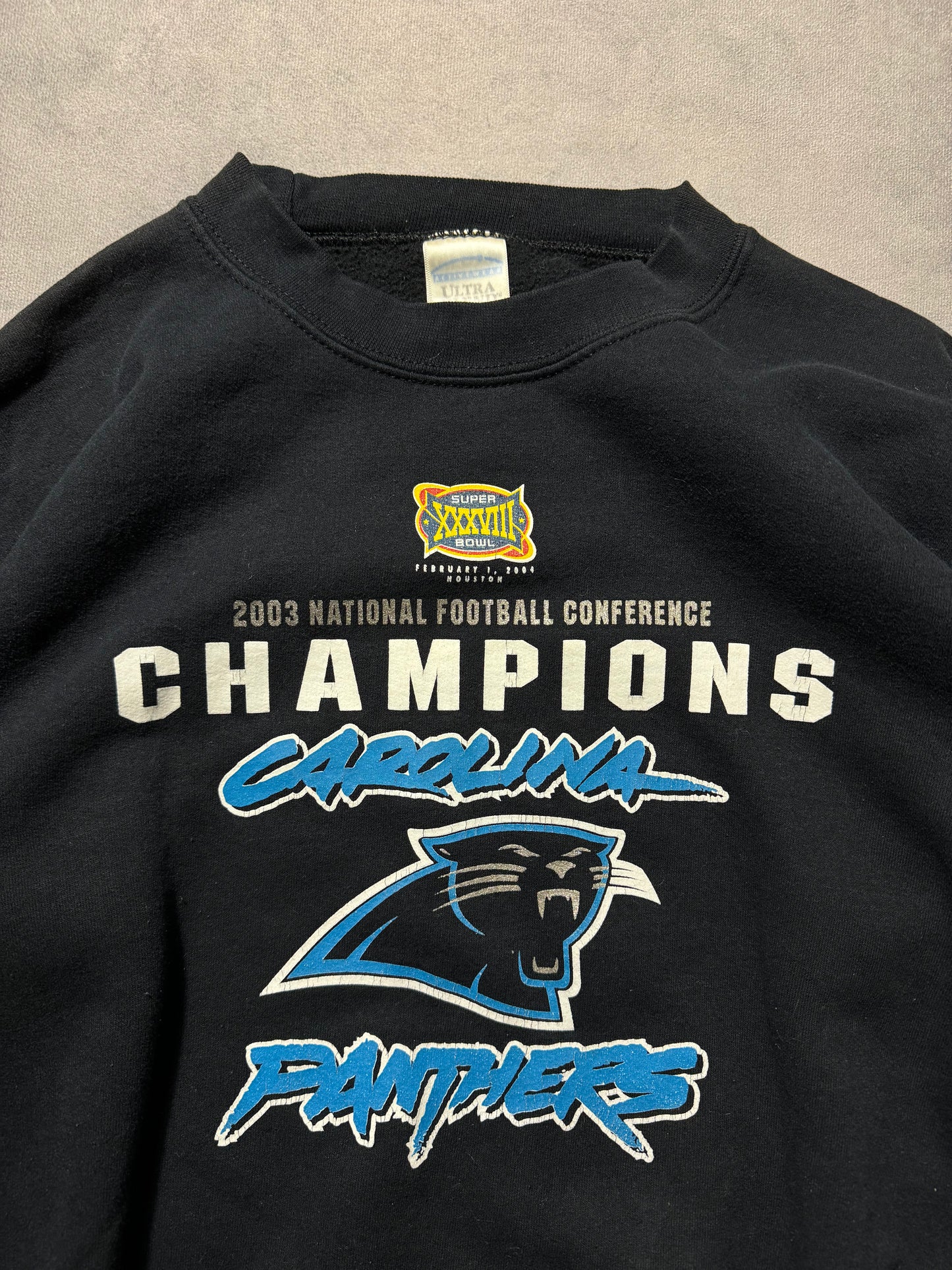 2003 Carolina Panthers Vintage NFC Champions Super Bowl XXXVIII Cat Scratch Font Logo NFL Crewneck (Medium)