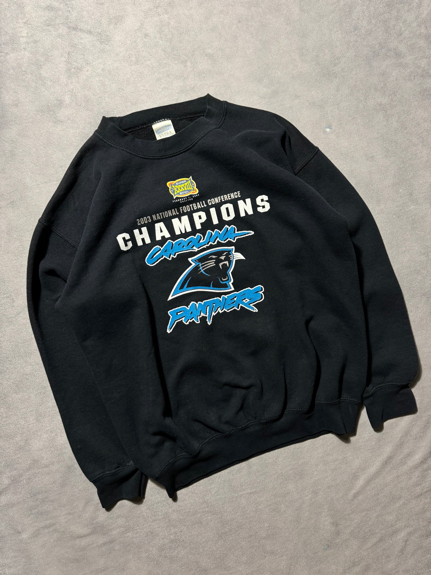 2003 Carolina Panthers Vintage NFC Champions Super Bowl XXXVIII Cat Scratch Font Logo NFL Crewneck (Medium)