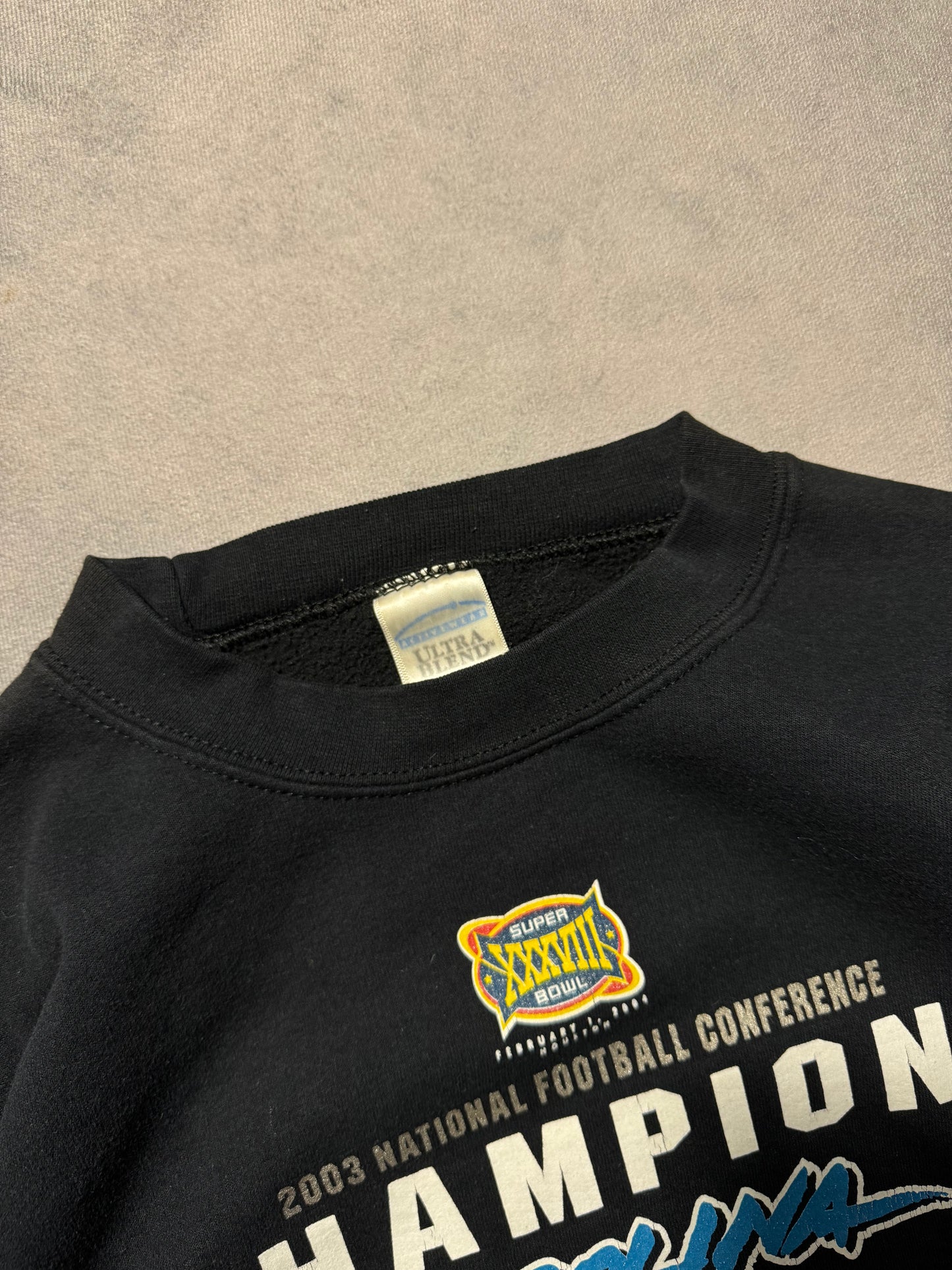 2003 Carolina Panthers Vintage NFC Champions Super Bowl XXXVIII Cat Scratch Font Logo NFL Crewneck (Medium)