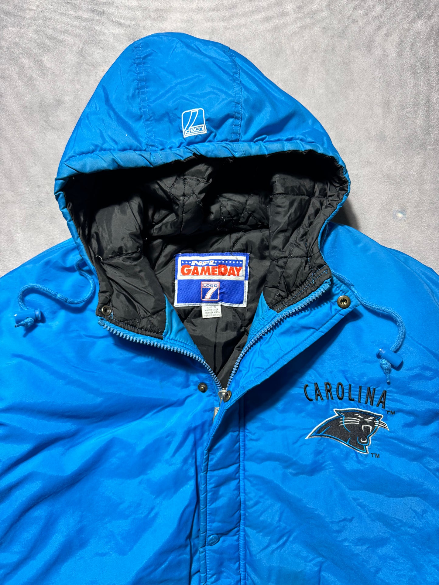 90’s Carolina Panthers Vintage Alternate Blue Logo 7 Game Day Embroidered NFL Puffer Jacket (XL)