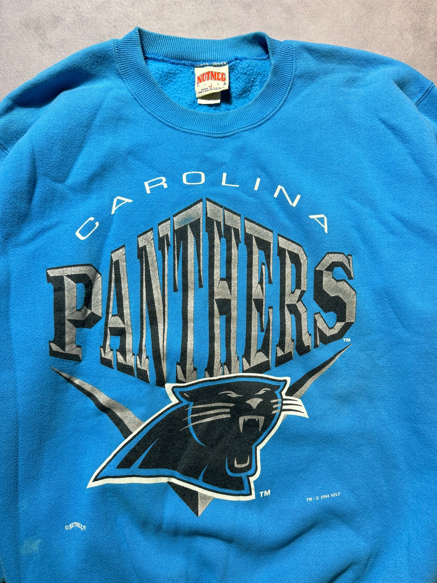 1994 Carolina Panthers Vintage Nutmeg Mills Blue Big Chevron NFL Spellout Crewneck (Medium)