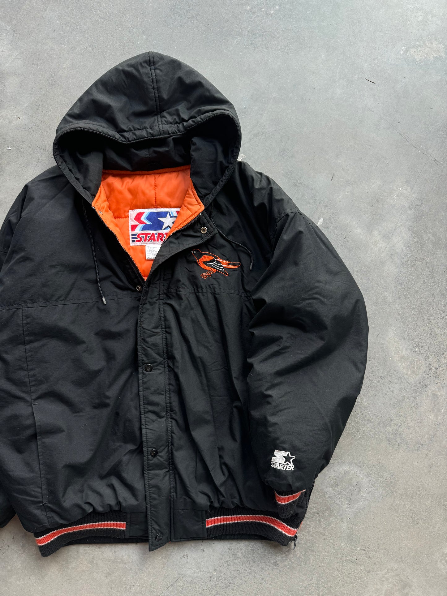 90’s Baltimore Orioles Vintage Black MLB Script Tailsweep Starter Puffer Jacket (XL)