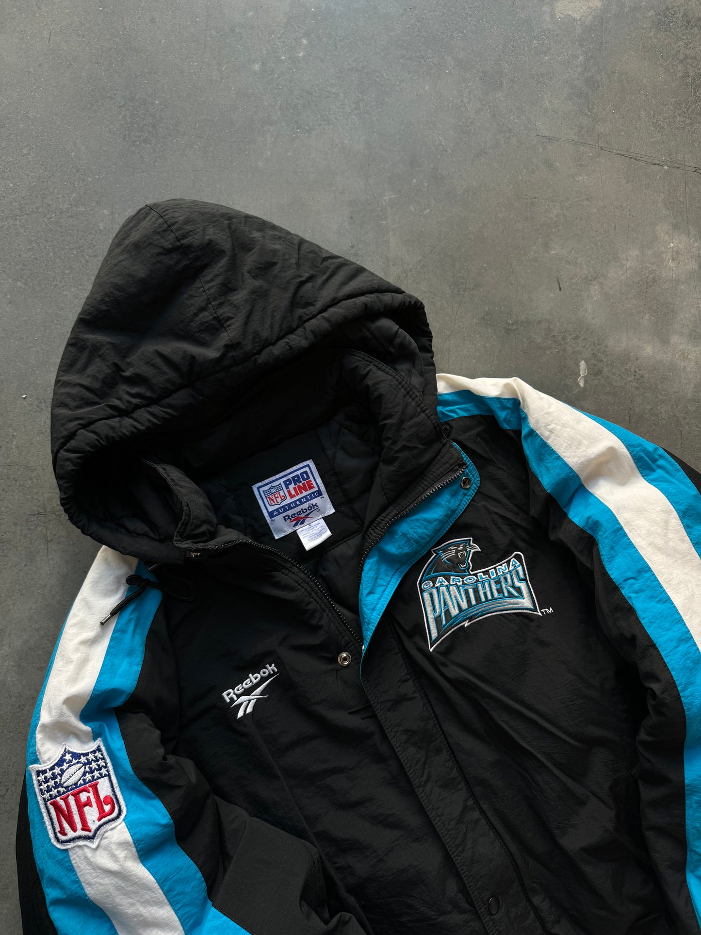 1995 Carolina Panthers Vintage Reebok NFL Pro Line Sleeve Striped Puffet Jacket (XL)