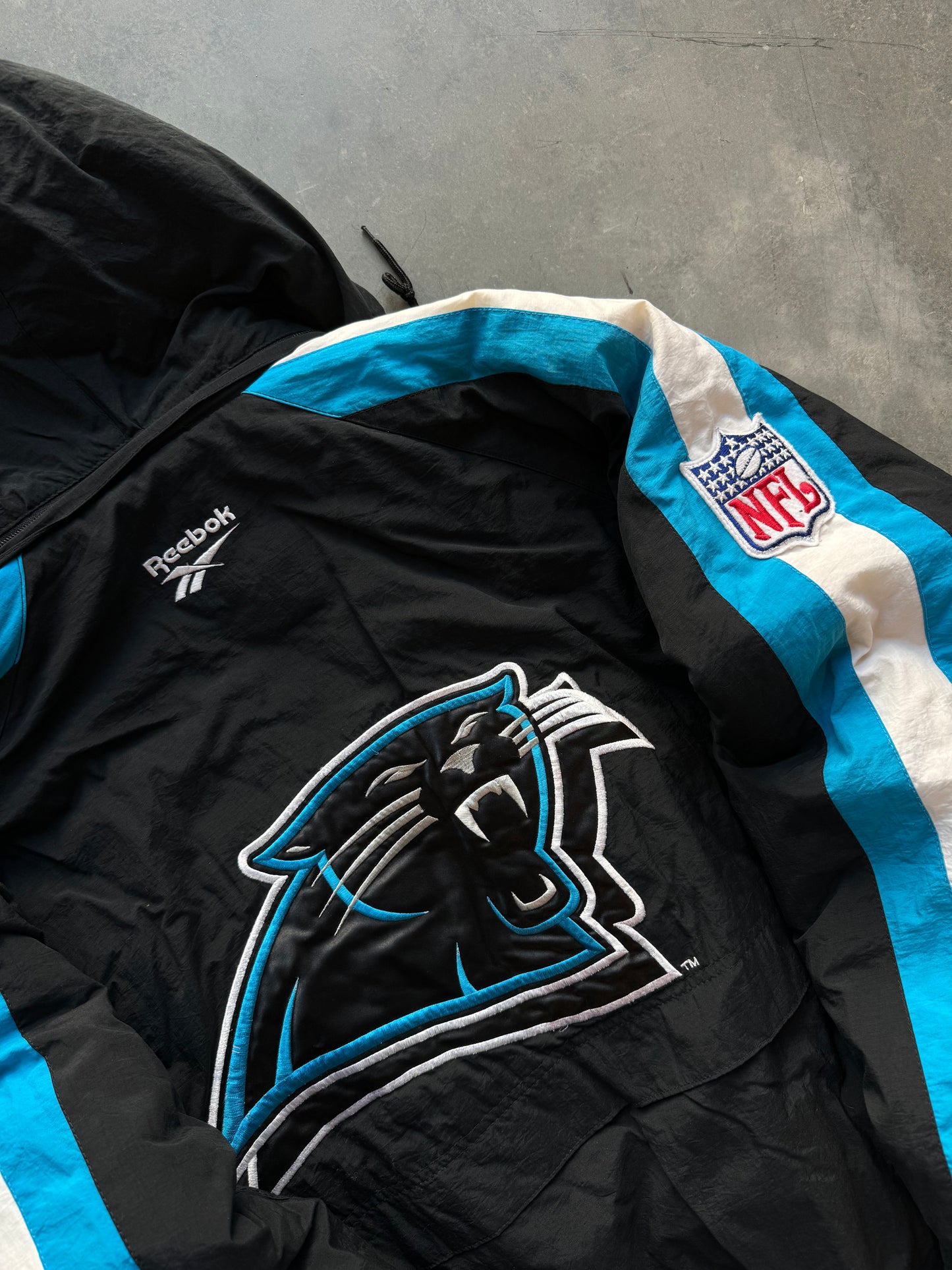 1995 Carolina Panthers Vintage Reebok NFL Pro Line Sleeve Striped Puffet Jacket (XL)