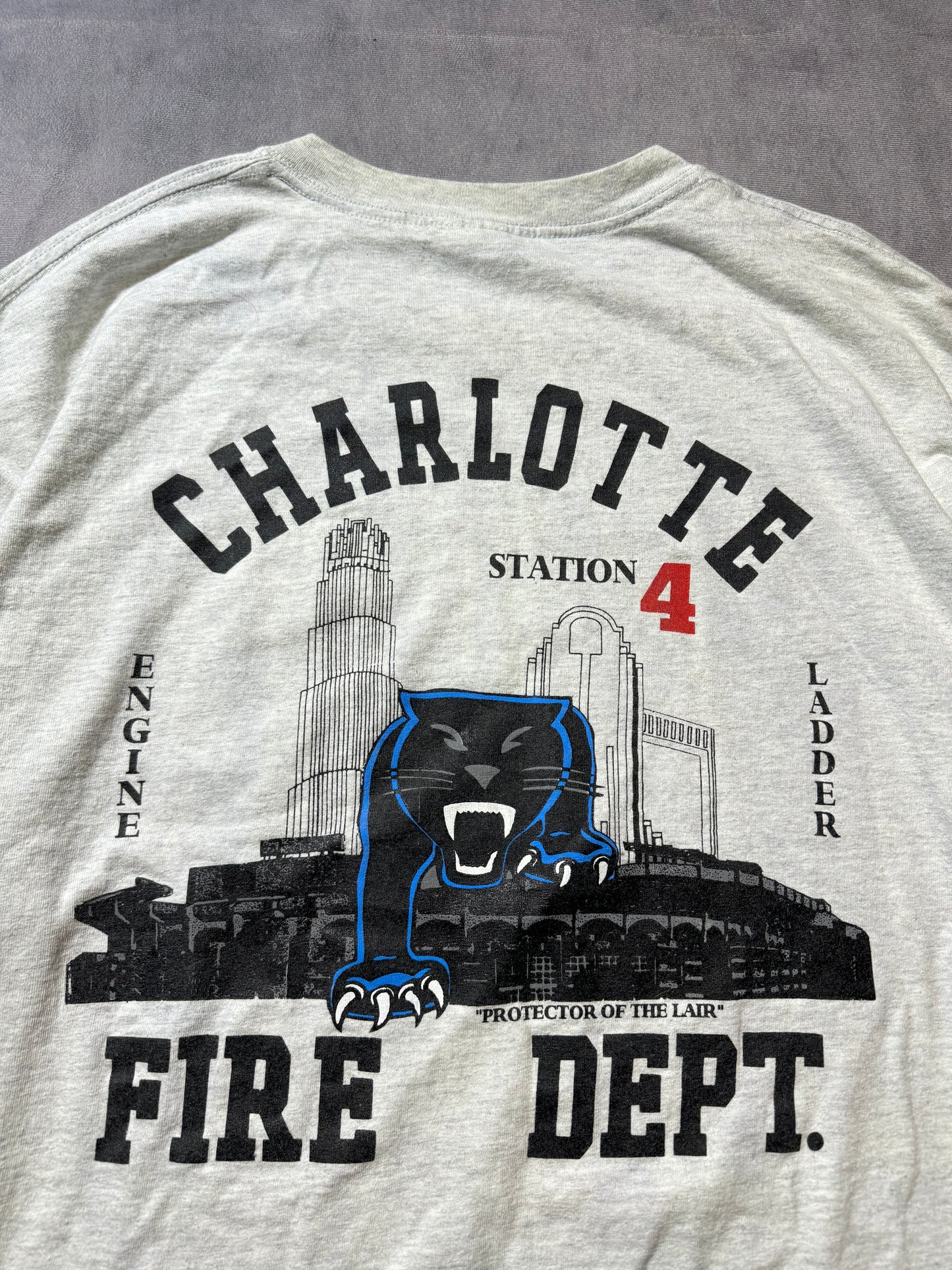 00’s Carolina Panthers x Charlotte Fire Dept Station 4 “Protectors of the Lair” Vintage Heather Grey NFL Tee (XXL)