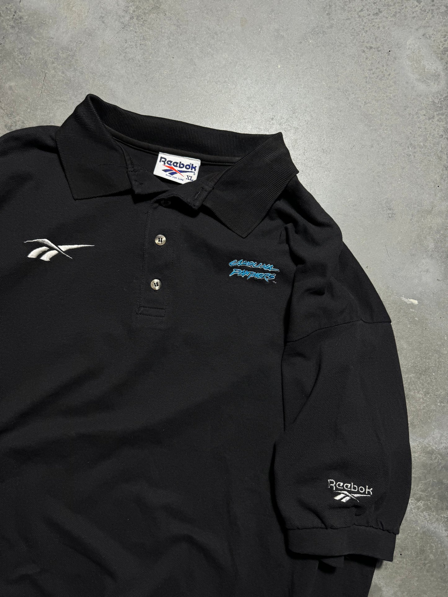1995 Carolina Panthers Vintage Black Reebok Cat Scratch Font Logo Embroidered Sideline Style NFL Collared Polo Shirt (XL)