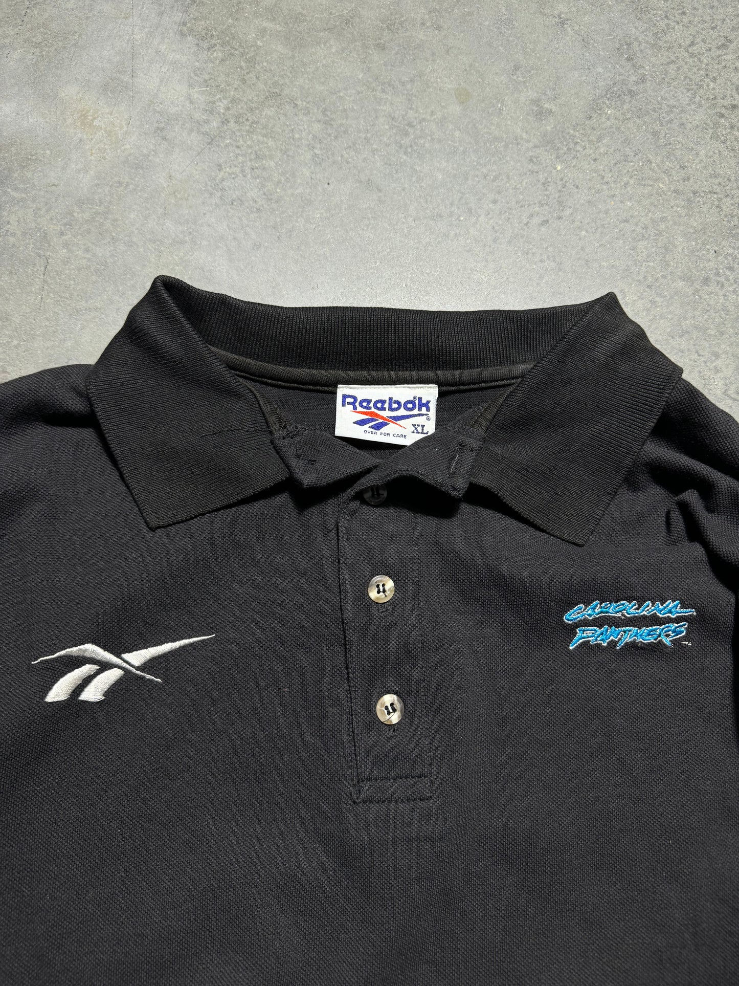 1995 Carolina Panthers Vintage Black Reebok Cat Scratch Font Logo Embroidered Sideline Style NFL Collared Polo Shirt (XL)